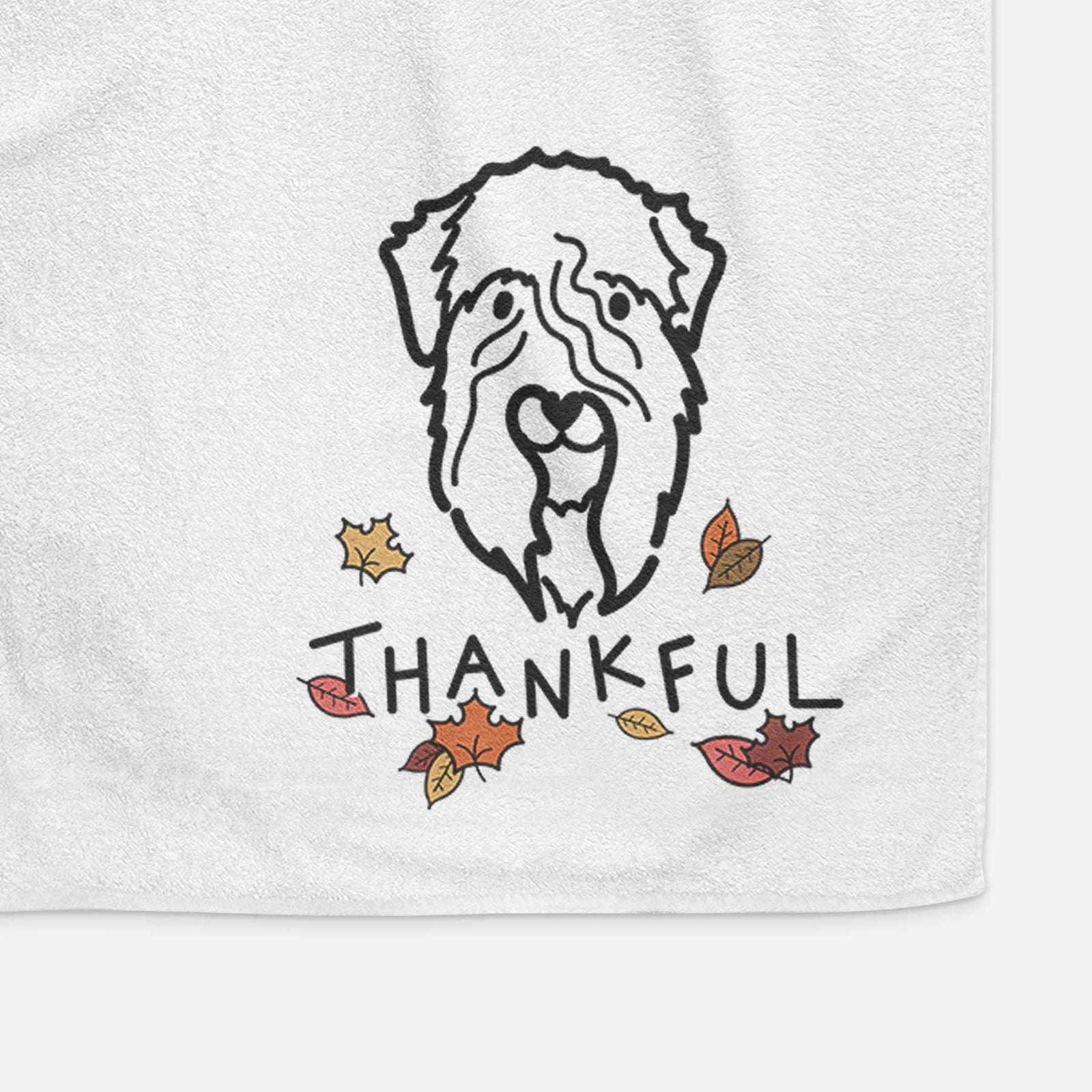 Minimalist line drawing of a Soft Coated Wheaten Terrier with 'Thankful' lettering on a decorative hand towel