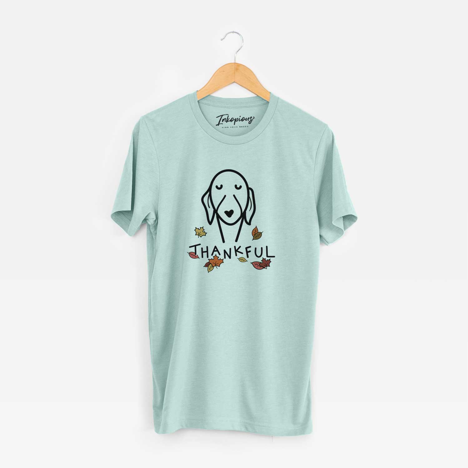 Minimalist line drawing of a Whippet with 'Thankful' lettering on a Heather Sage Unisex crewneck