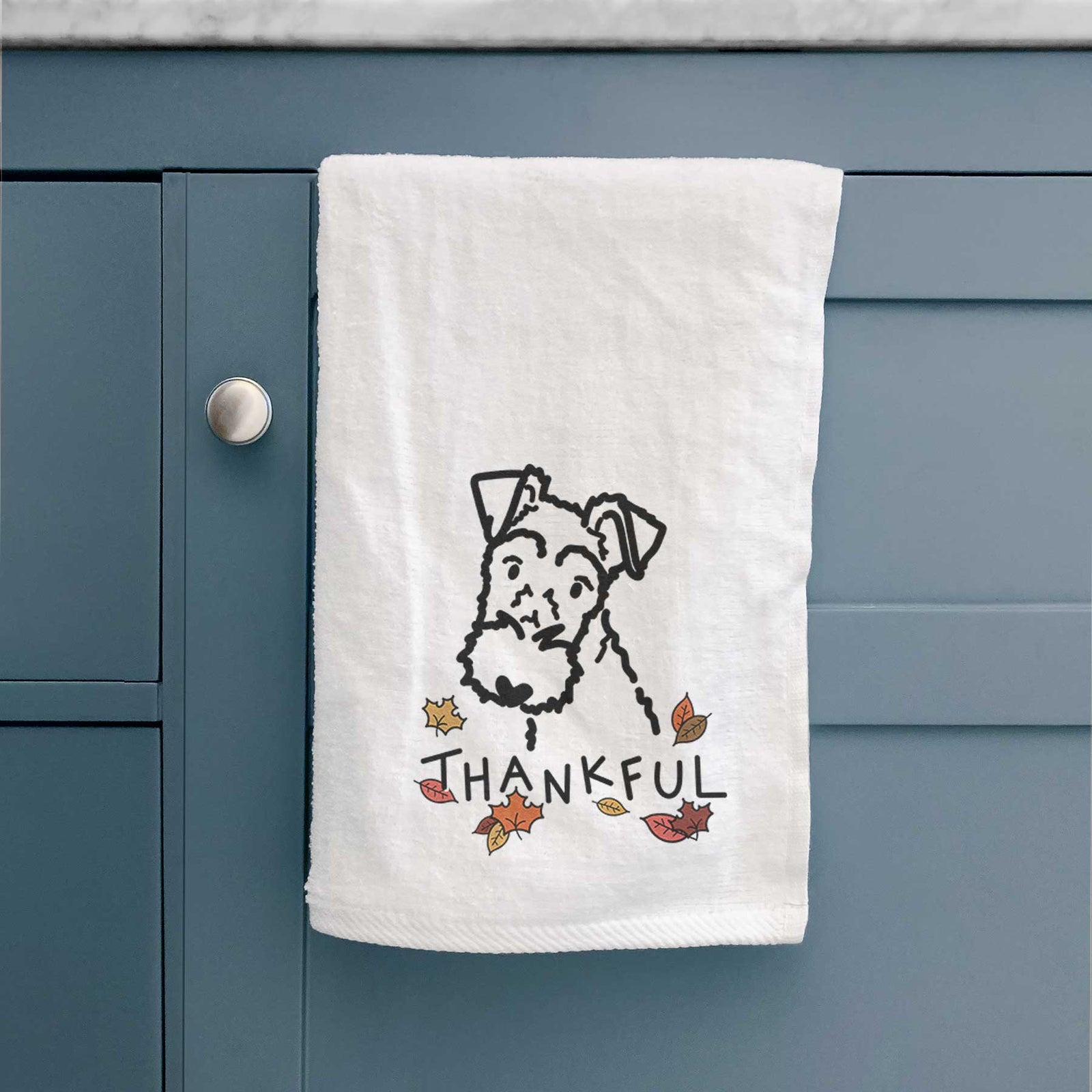 Minimalist line drawing of a Wire Fox Terrier with 'Thankful' lettering on a decorative hand towel
