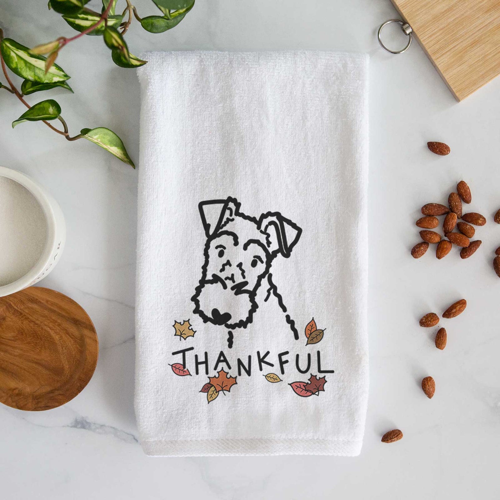 Minimalist line drawing of a Wire Fox Terrier with 'Thankful' lettering on a decorative hand towel