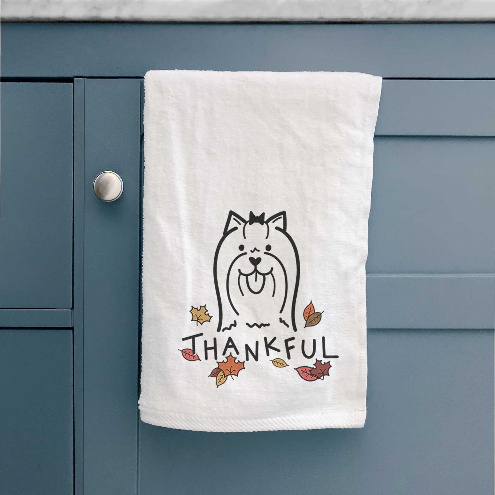 Minimalist line drawing of a Yorkshire Terrier with 'Thankful' lettering on a decorative hand towel