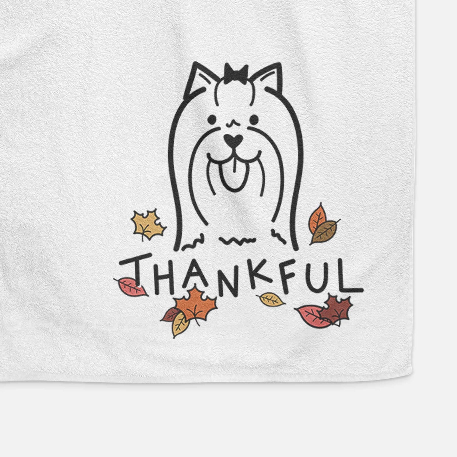 Minimalist line drawing of a Yorkshire Terrier with 'Thankful' lettering on a decorative hand towel
