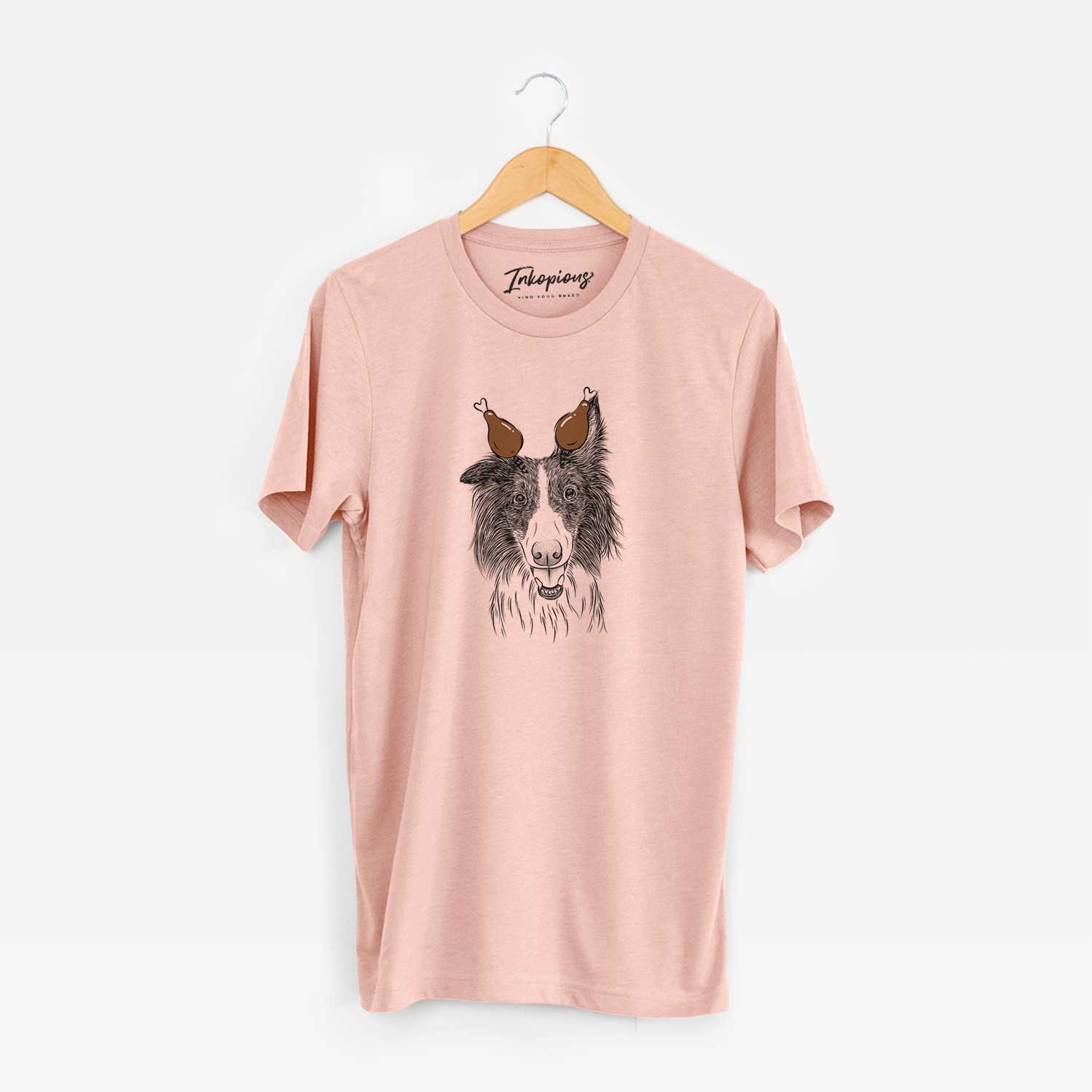 Hand-drawn sketch of Archie the Silken Windhound with a Thanksgiving turkey headpiece on a Peach Unisex crewneck
