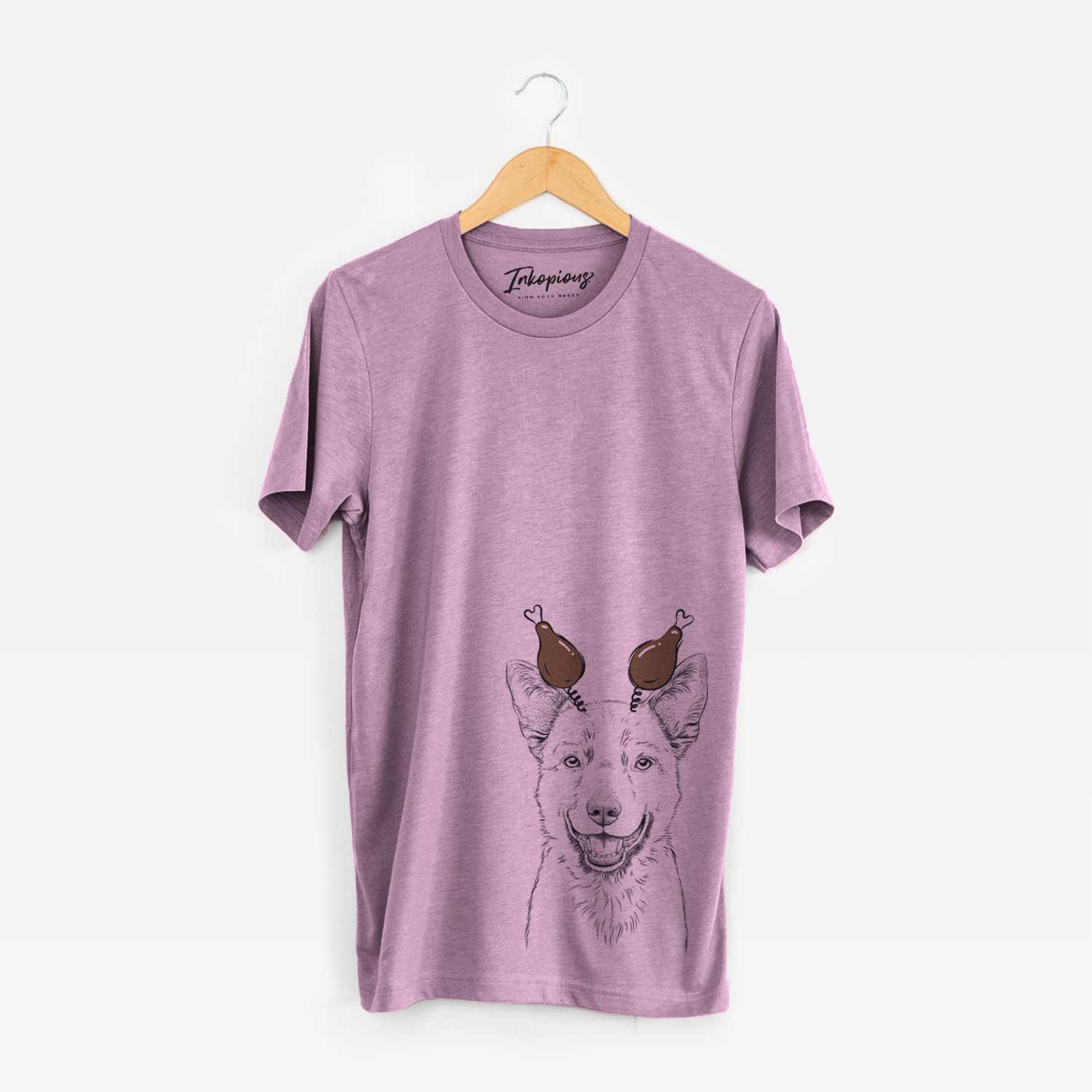 Hand-drawn sketch of Arden the Australian Kelpie with a Thanksgiving turkey headpiece on an Orchid Unisex crewneck