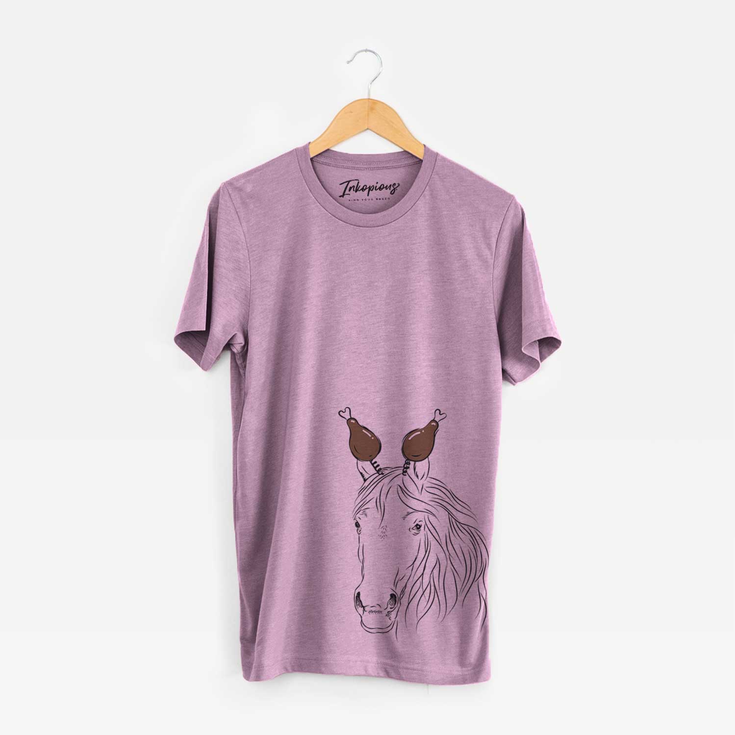 Hand-drawn sketch of Aria the Horse with a Thanksgiving turkey headpiece on an Orchid Unisex crewneck