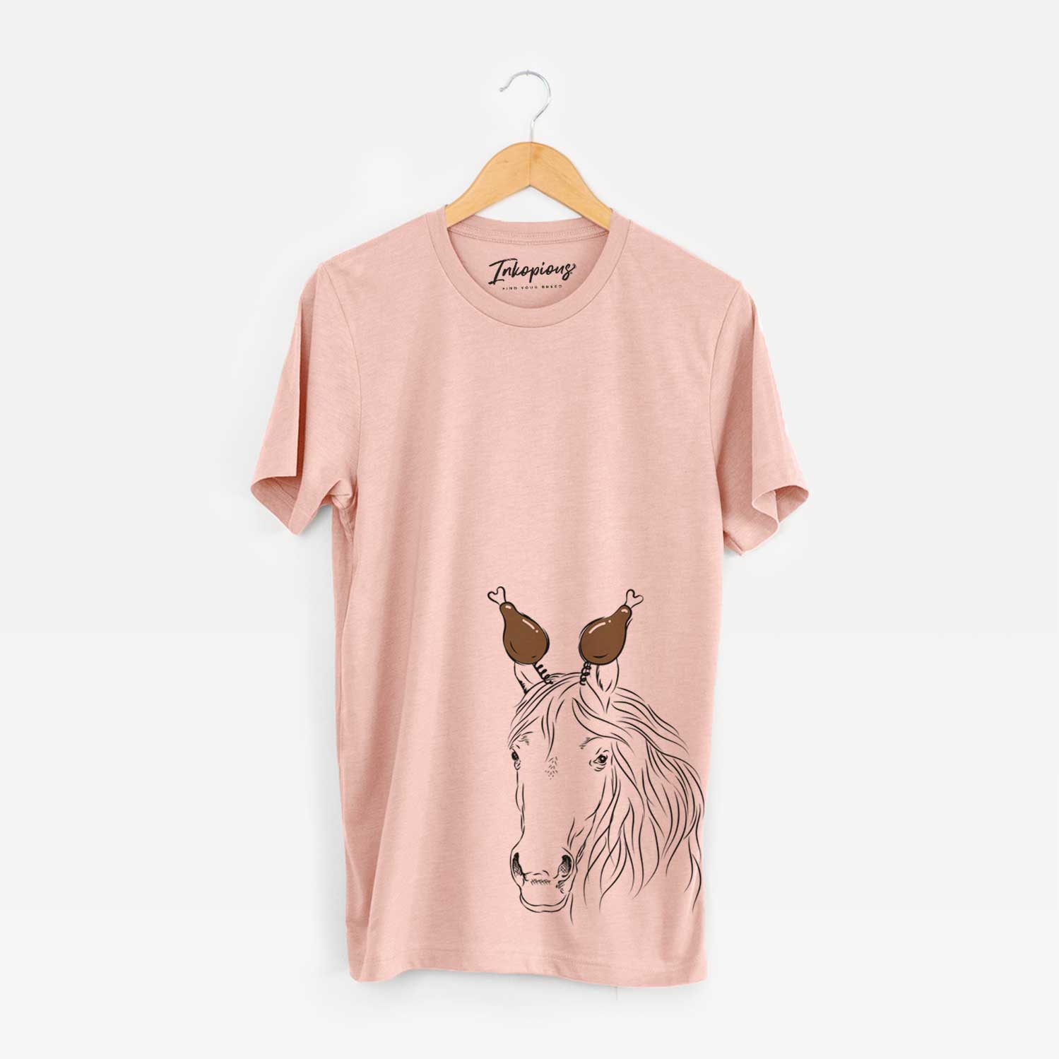 Hand-drawn sketch of Aria the Horse with a Thanksgiving turkey headpiece on a Peach Unisex crewneck