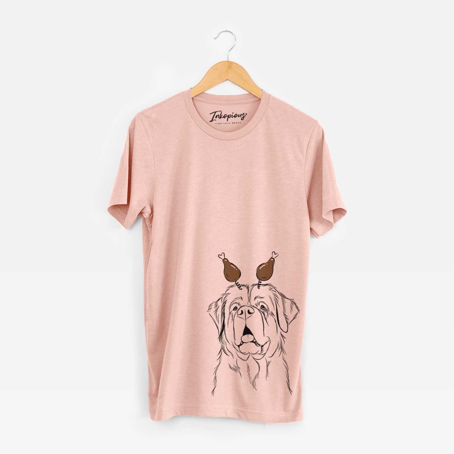 Hand-drawn sketch of Atlas the Saint Bernard with a Thanksgiving turkey headpiece on a Peach Unisex crewneck