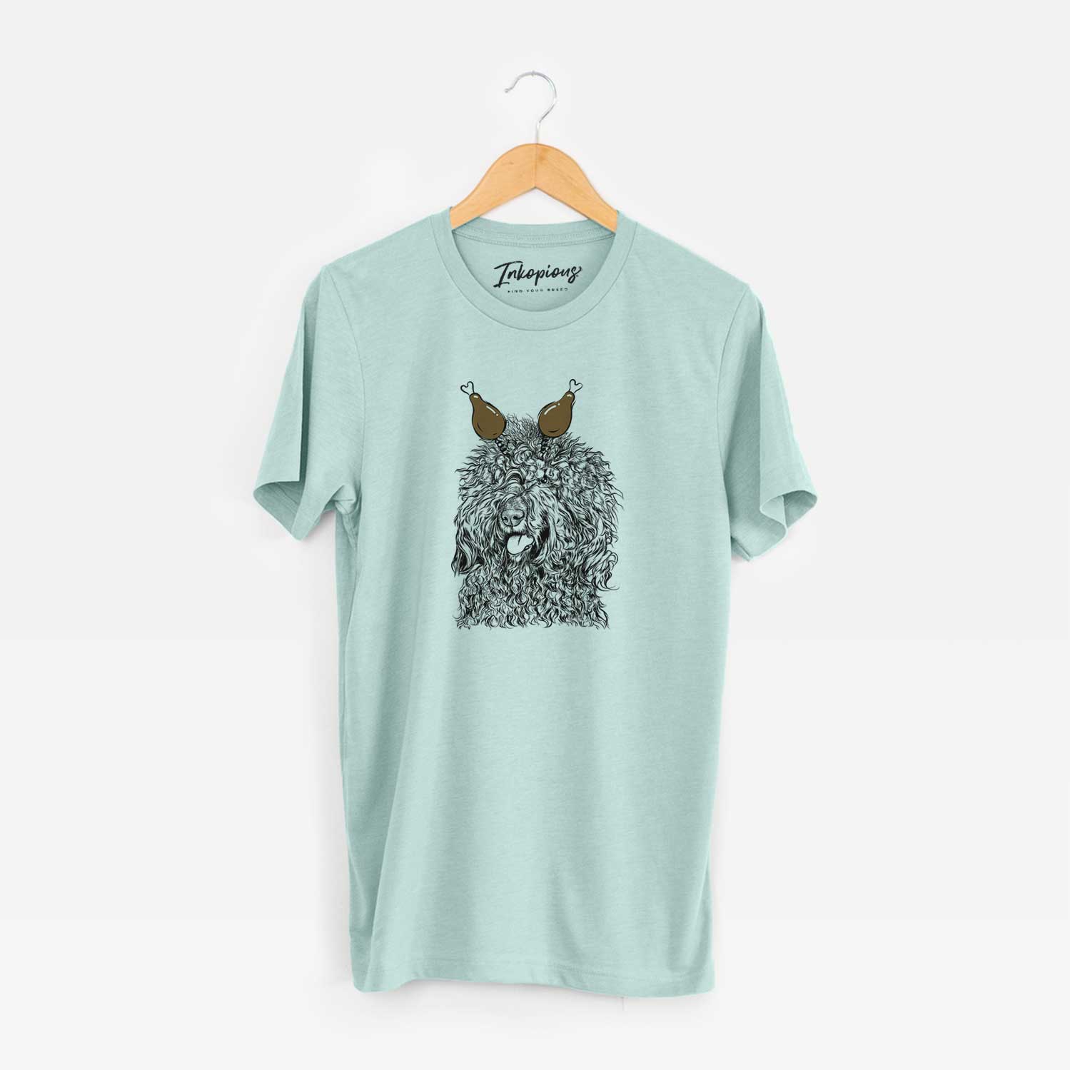 Hand-drawn sketch of Babs the Barbet with a Thanksgiving turkey headpiece on a Heather Sage Unisex crewneck
