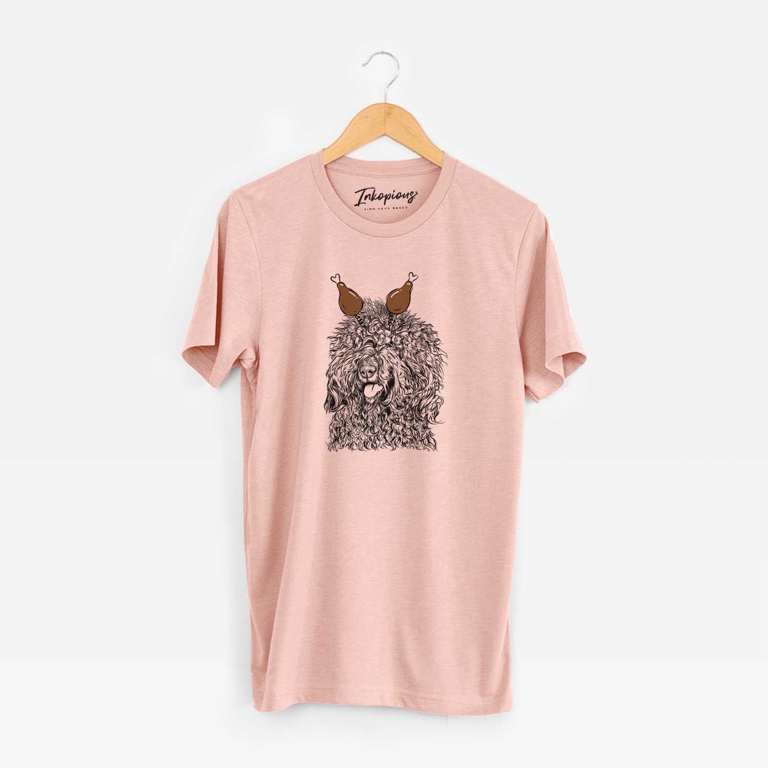 Hand-drawn sketch of Babs the Barbet with a Thanksgiving turkey headpiece on a Peach Unisex crewneck