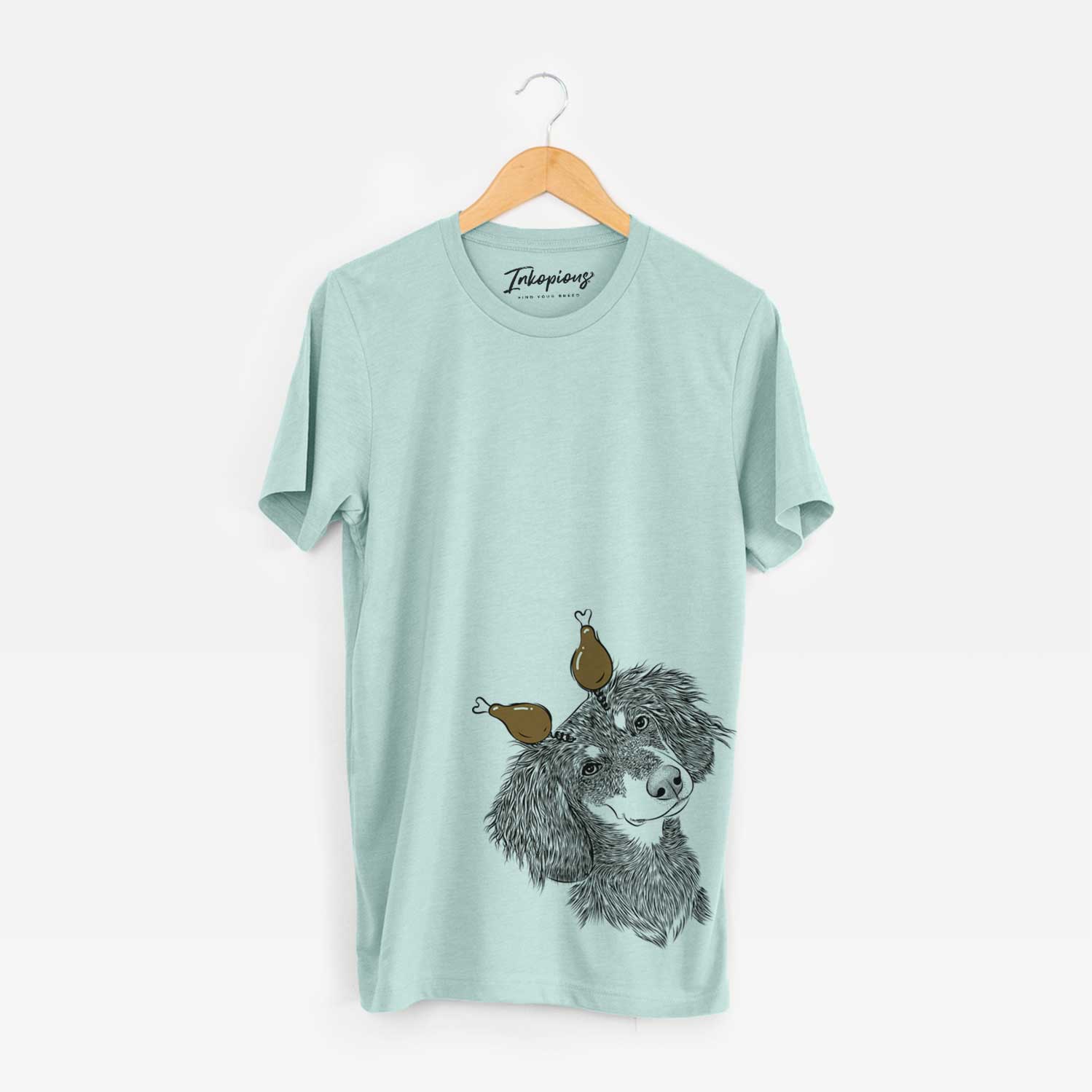 Hand-drawn sketch of Bailey the Long Haired Dachshund with a Thanksgiving turkey headpiece on a Heather Sage Unisex crewneck