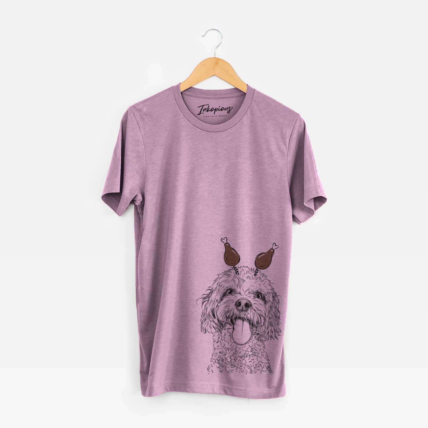 Hand-drawn sketch of Barney the Cavachon with a Thanksgiving turkey headpiece on an Orchid Unisex crewneck