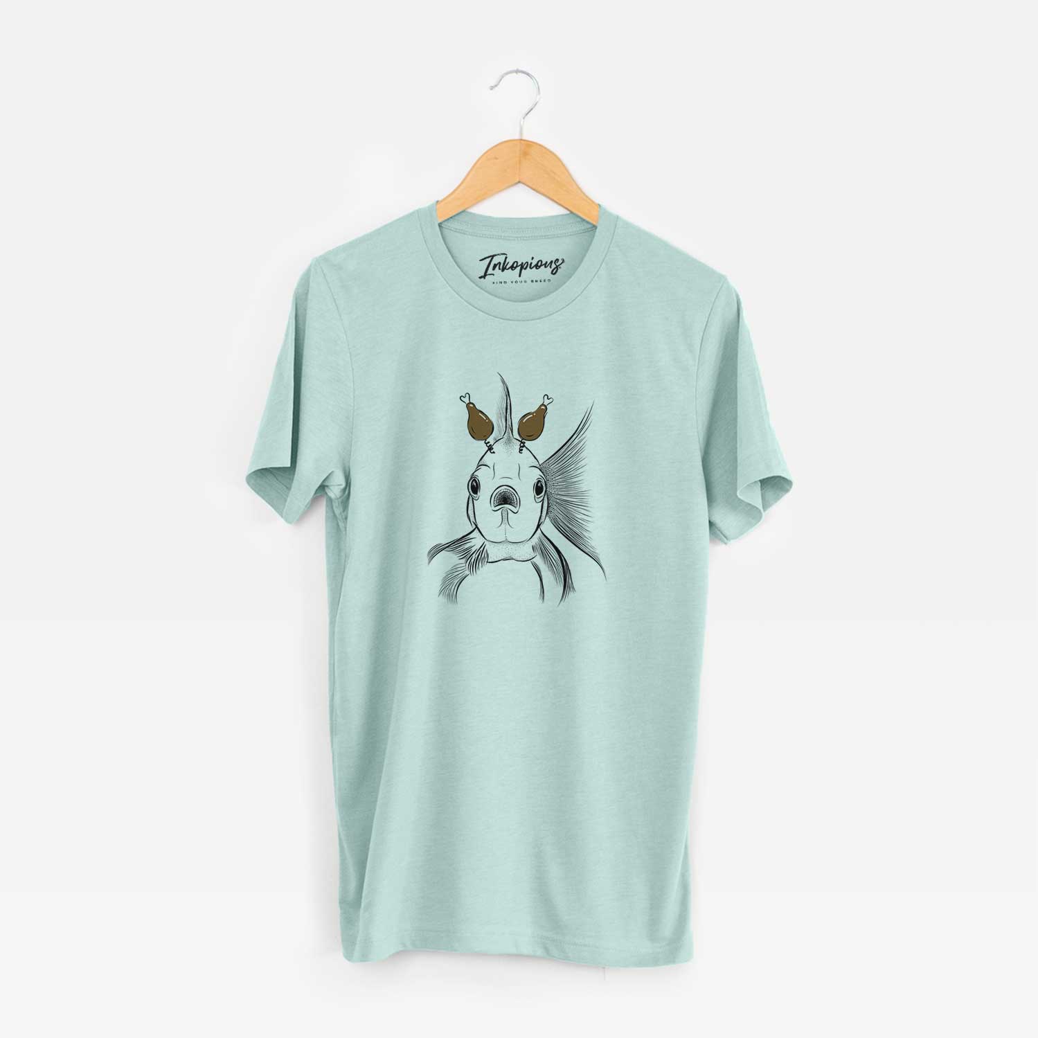 Hand-drawn sketch of Beefcake the Goldfish with a Thanksgiving turkey headpiece on a Heather Sage Unisex crewneck