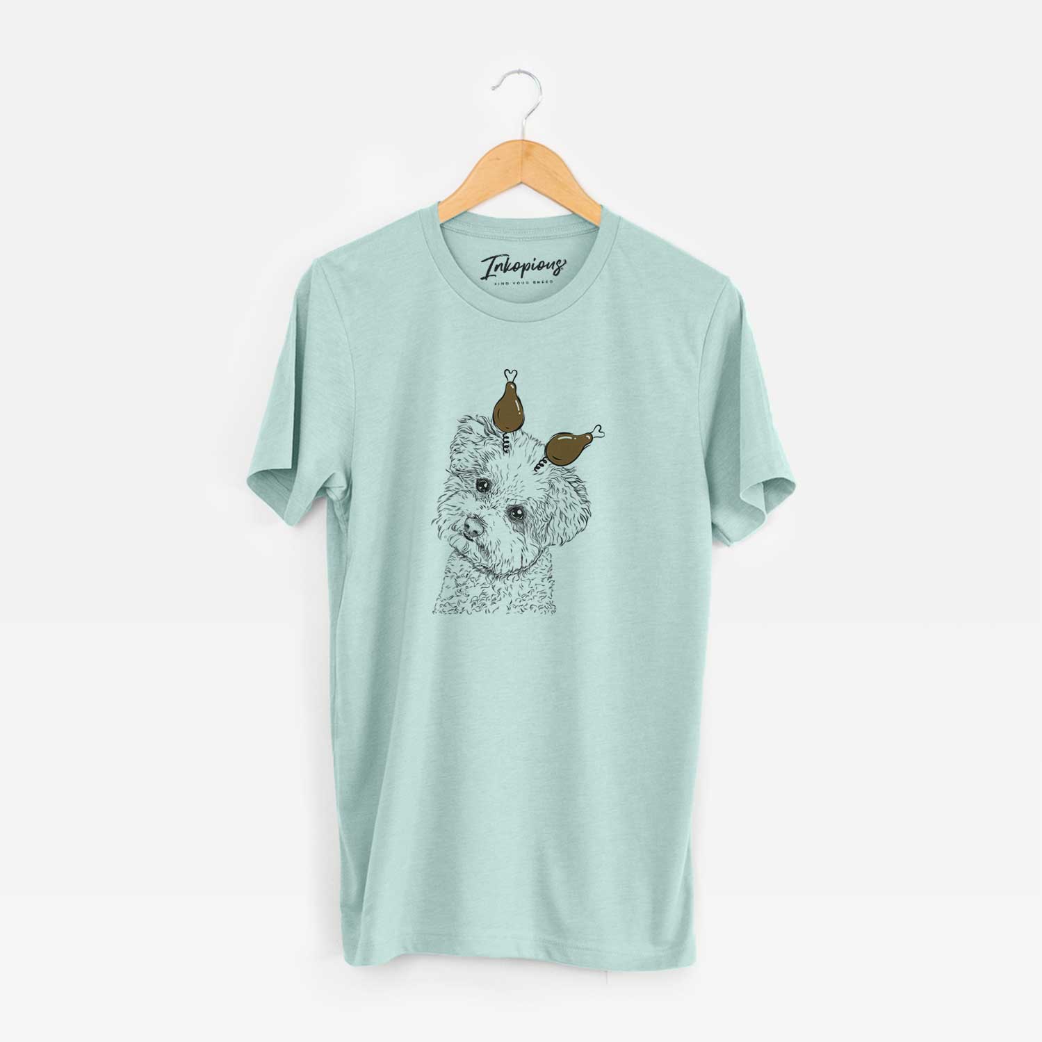 Hand-drawn sketch of Bento the Bolognese with a Thanksgiving turkey headpiece on a Heather Sage Unisex crewneck