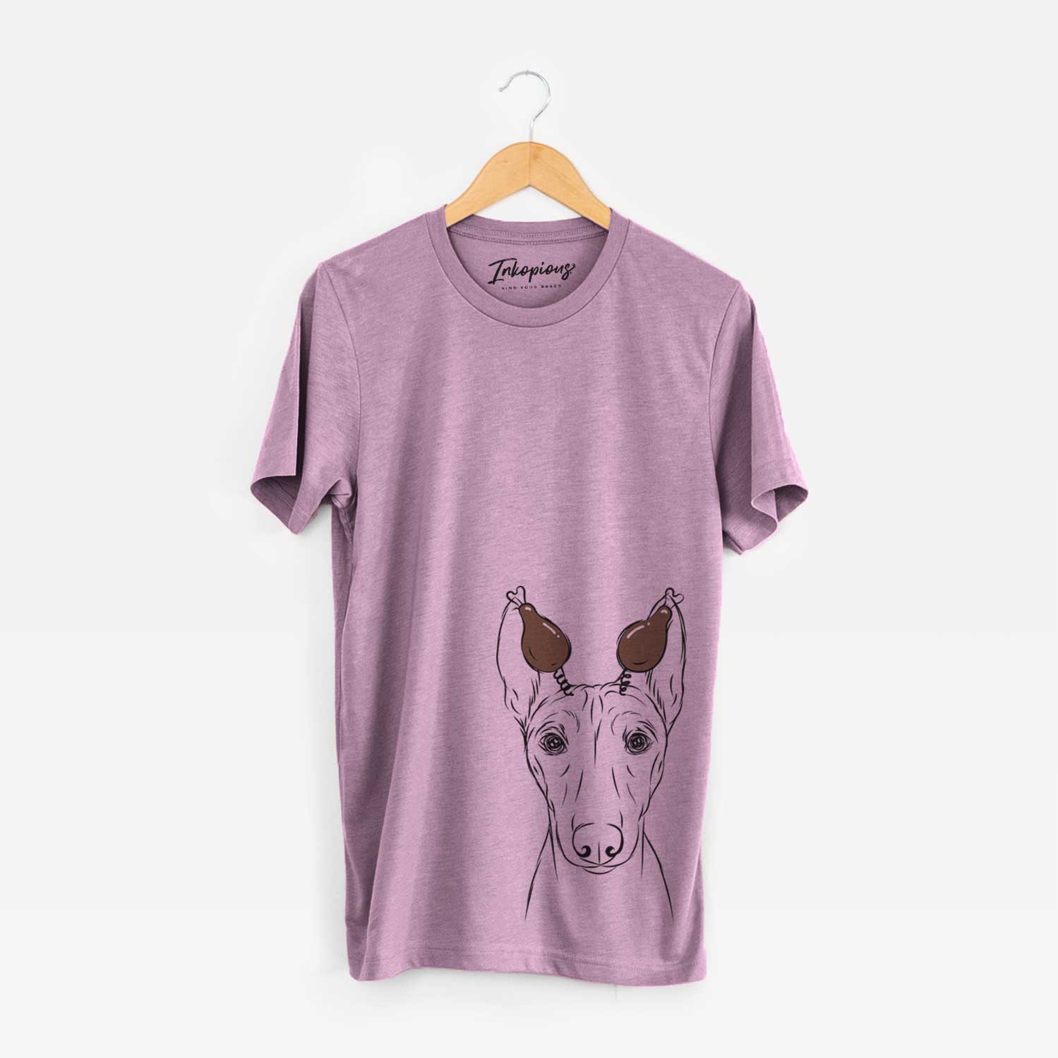 Hand-drawn sketch of Bonsai the Basenji with a Thanksgiving turkey headpiece on an Orchid Unisex crewneck