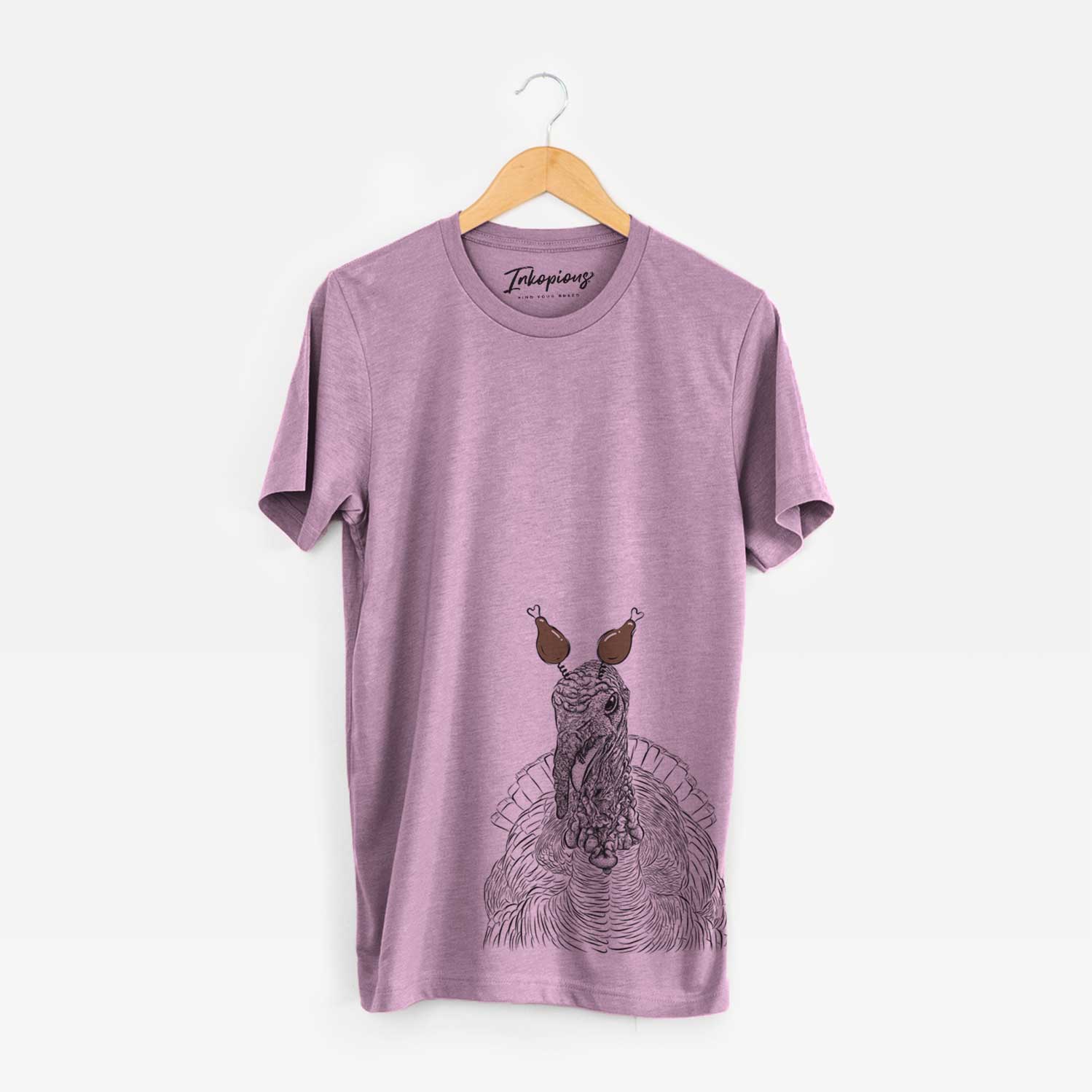 Hand-drawn sketch of Brady the Turkey with a Thanksgiving turkey headpiece on an Orchid Unisex crewneck
