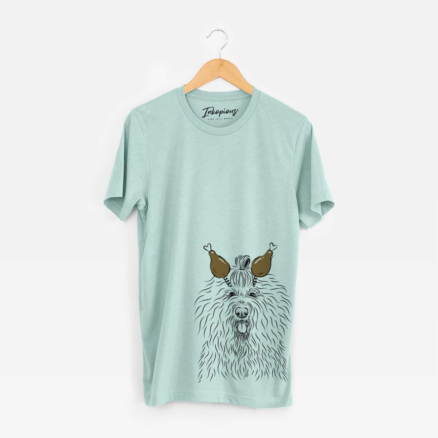 Hand-drawn sketch of Brody the Old English Sheepdog with a Thanksgiving turkey headpiece on a Heather Sage Unisex crewneck