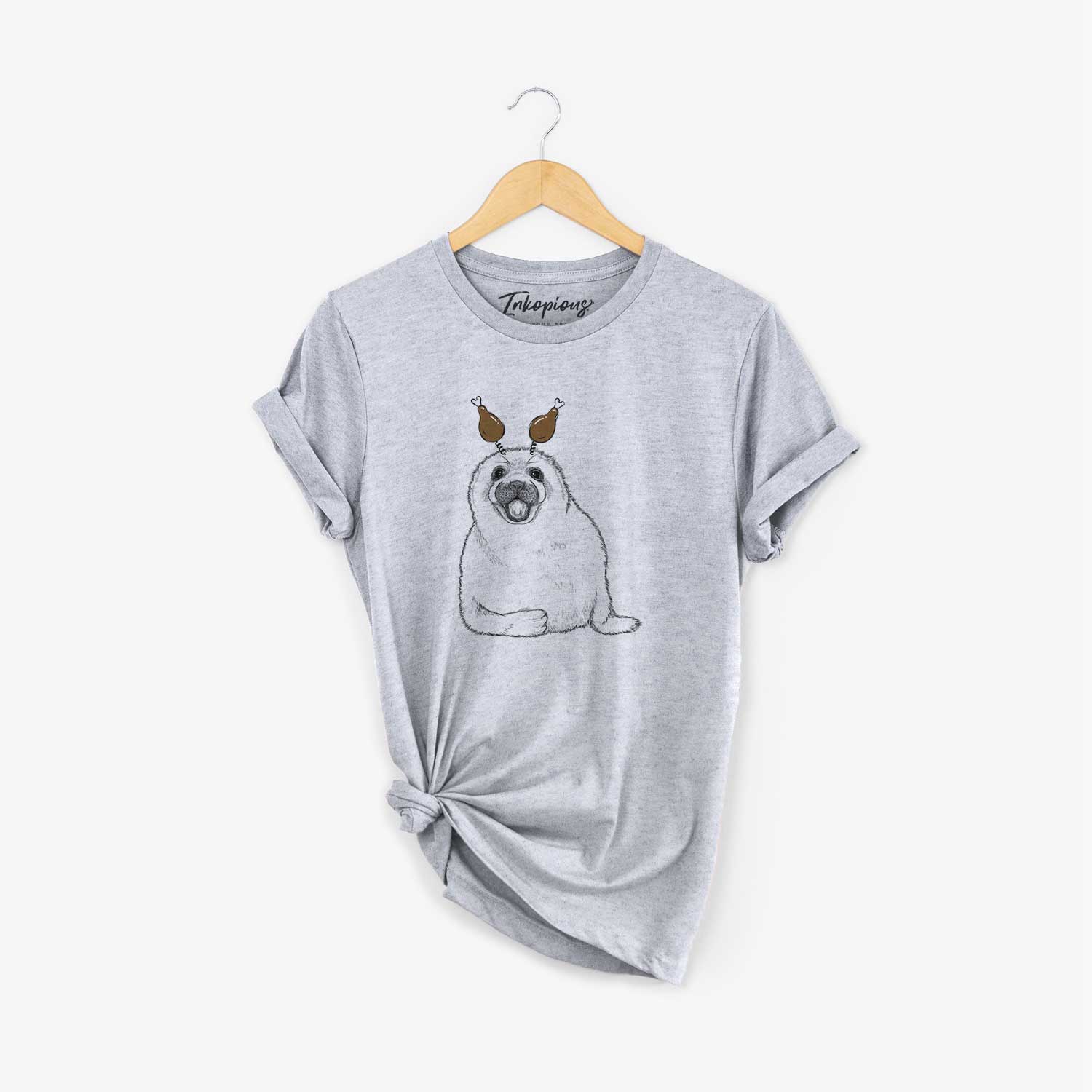Hand-drawn sketch of Bub the Harp Seal with a Thanksgiving turkey headpiece on a Grey Unisex crewneck