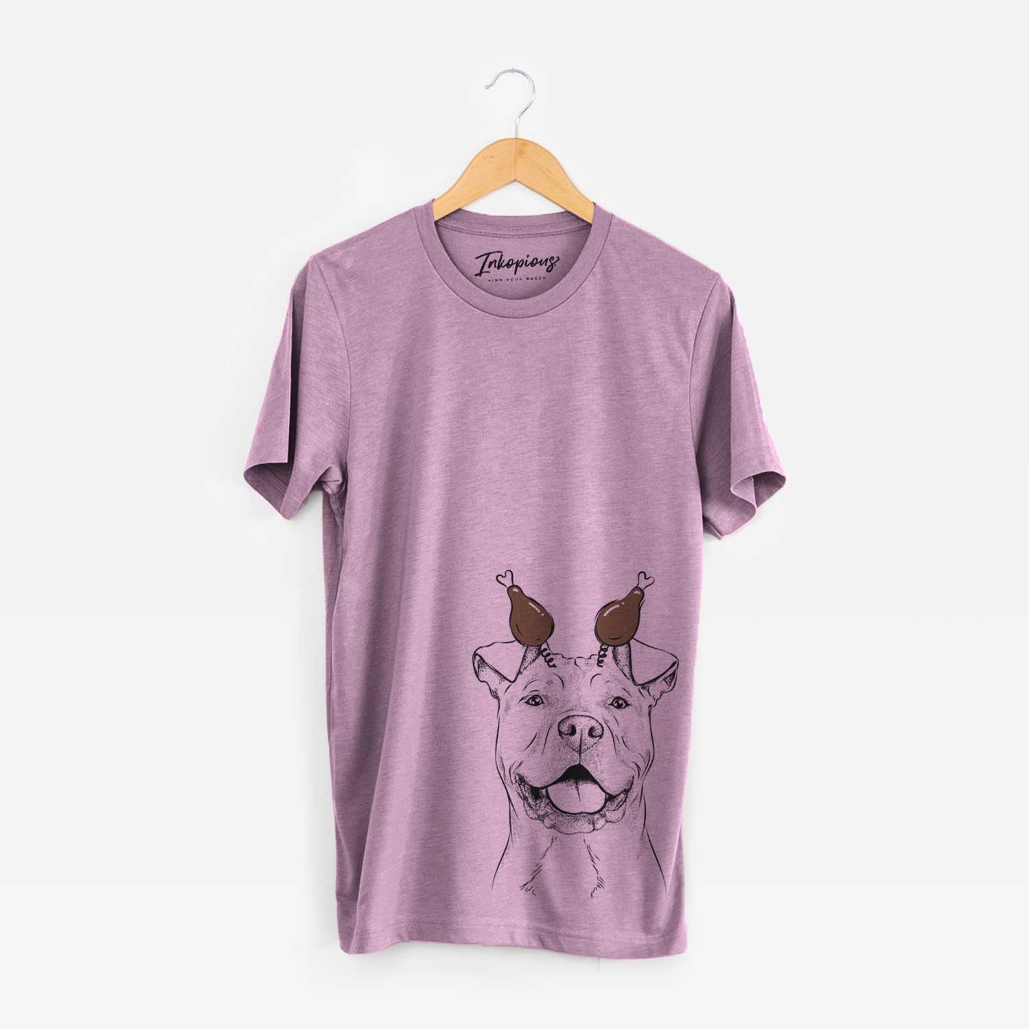 Hand-drawn sketch of Bubba Scraps the American Staffordshire Mix with a Thanksgiving turkey headpiece on an Orchid Unisex crewneck