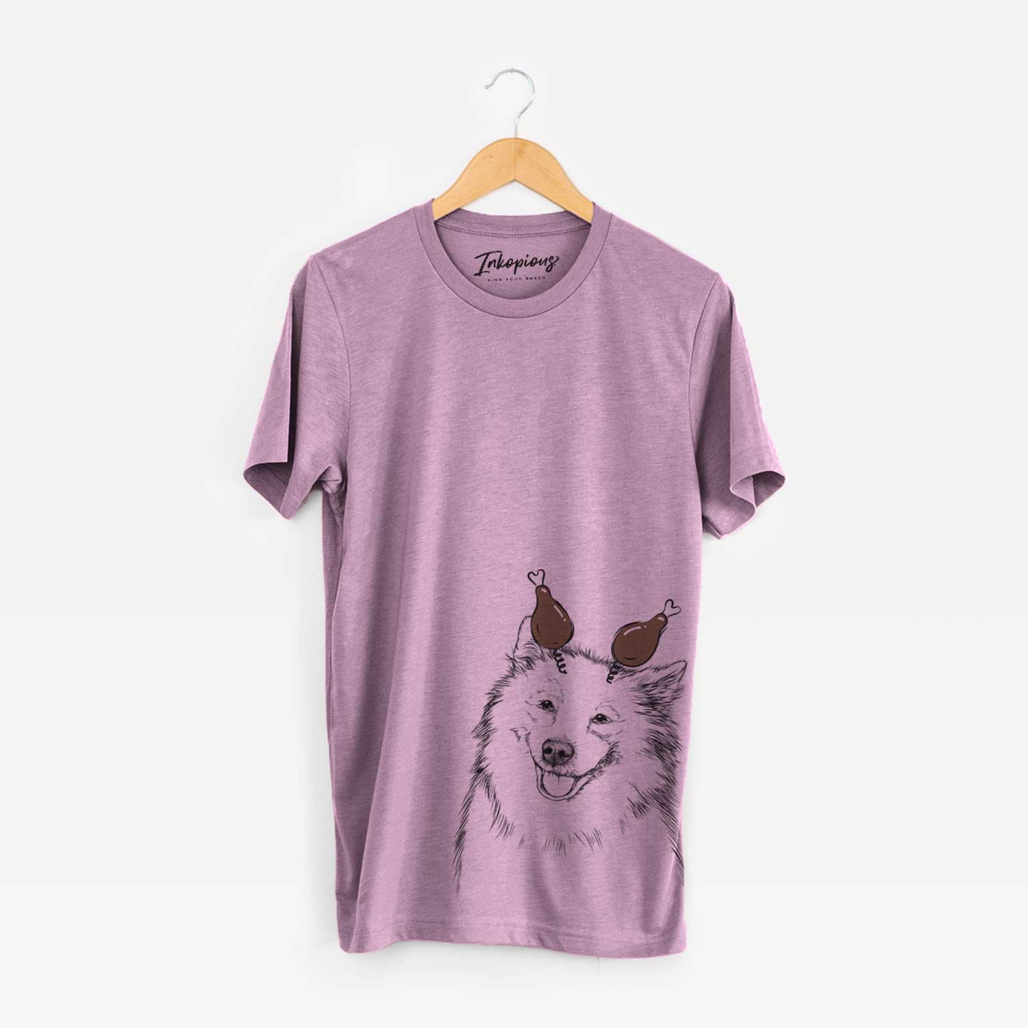 Hand-drawn sketch of Caico the Samoyed with a Thanksgiving turkey headpiece on an Orchid Unisex crewneck
