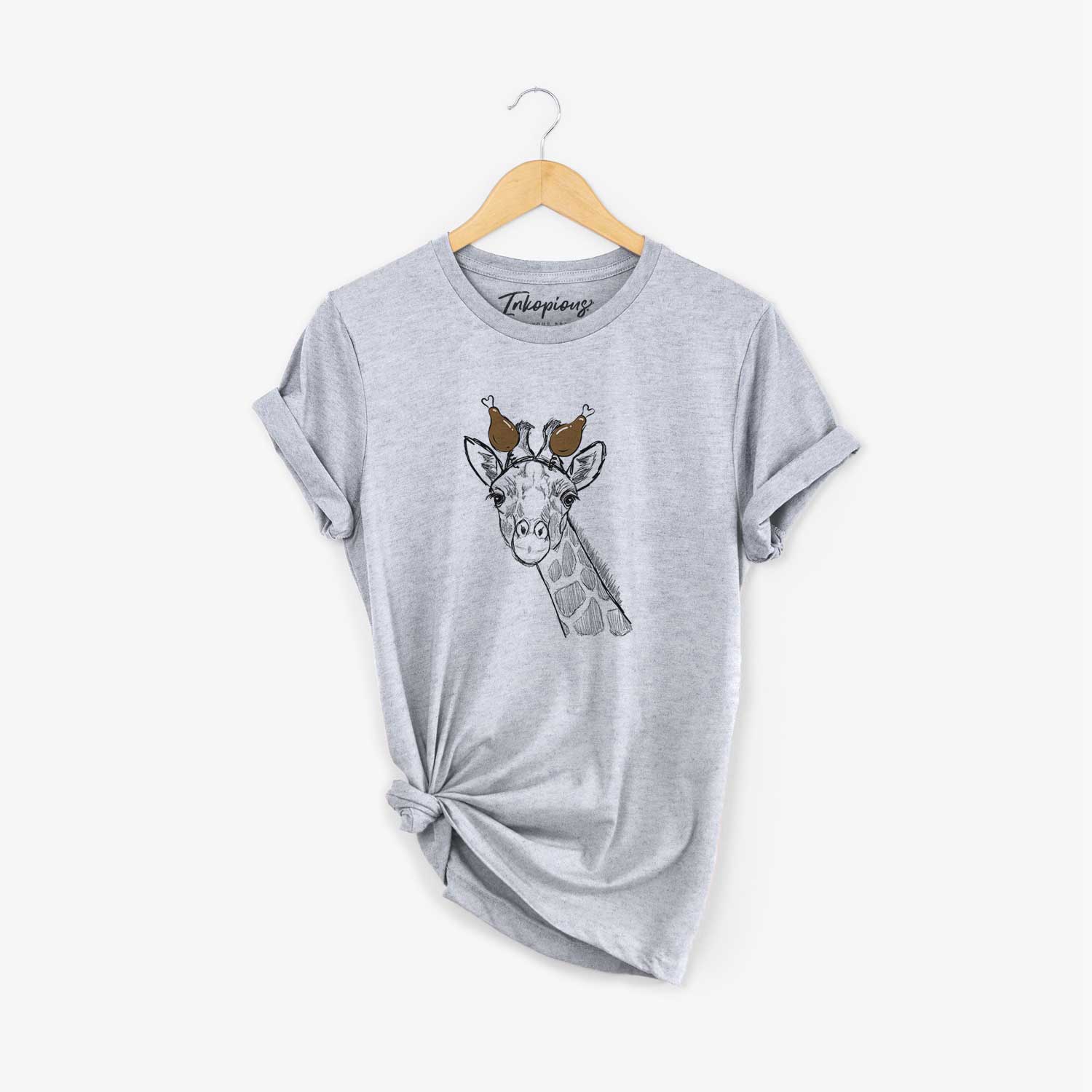 Hand-drawn sketch of Cedrick the Giraffe with a Thanksgiving turkey headpiece on a Grey Unisex crewneck