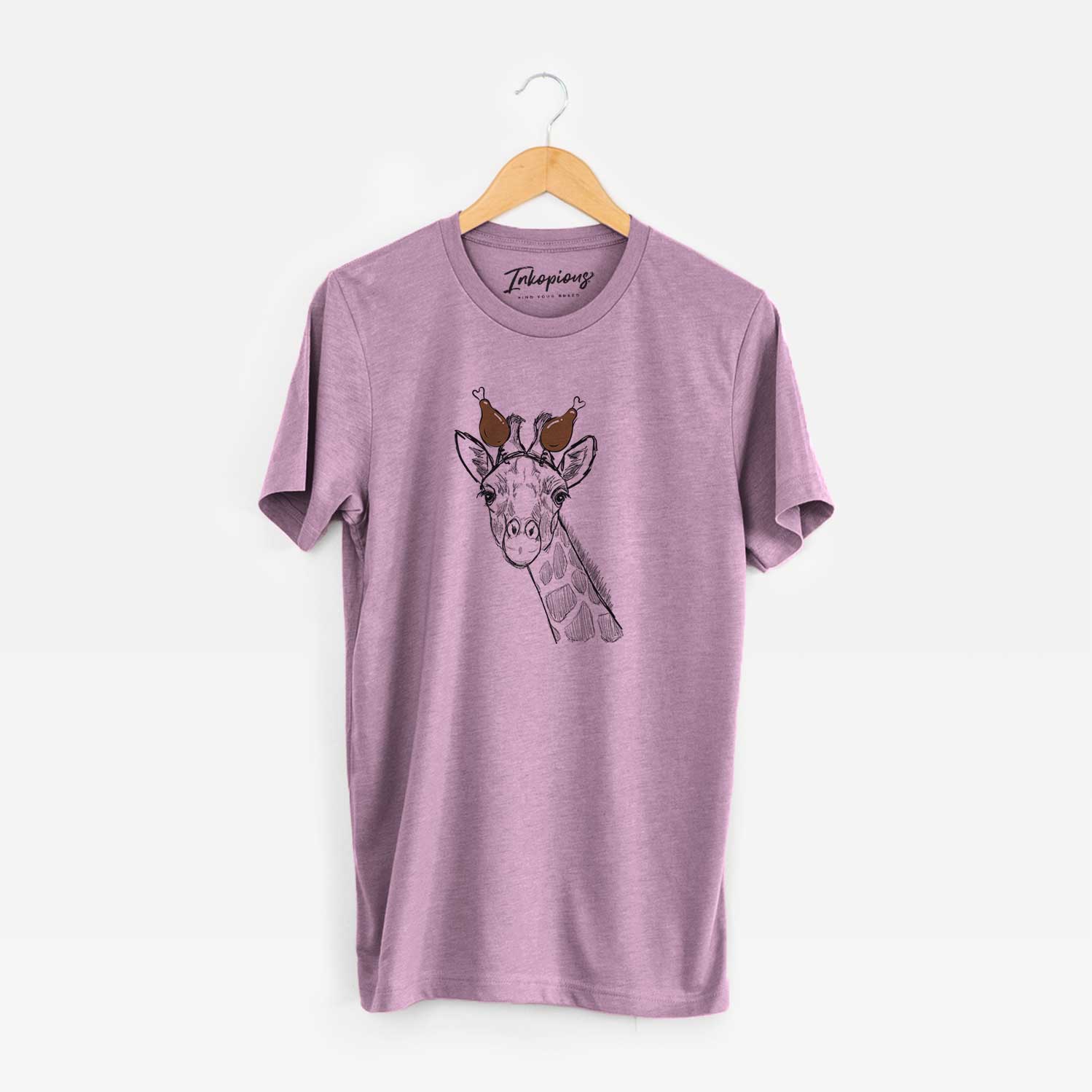 Hand-drawn sketch of Cedrick the Giraffe with a Thanksgiving turkey headpiece on an Orchid Unisex crewneck