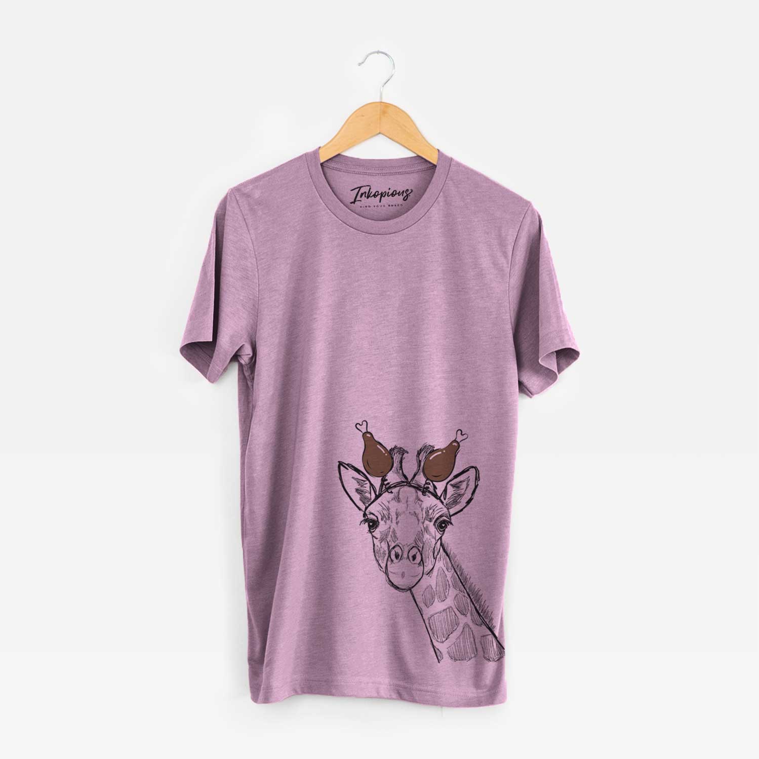 Hand-drawn sketch of Cedrick the Giraffe with a Thanksgiving turkey headpiece on an Orchid Unisex crewneck