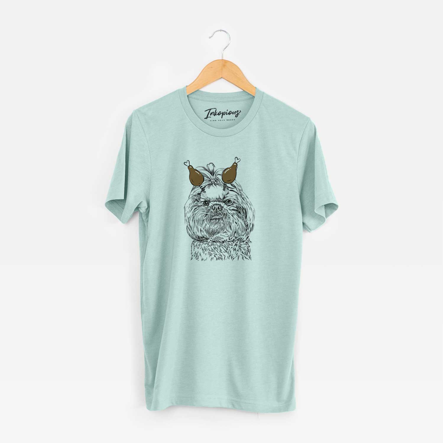 Hand-drawn sketch of Chewie the Shih Tzu with a Thanksgiving turkey headpiece on a Heather Sage Unisex crewneck