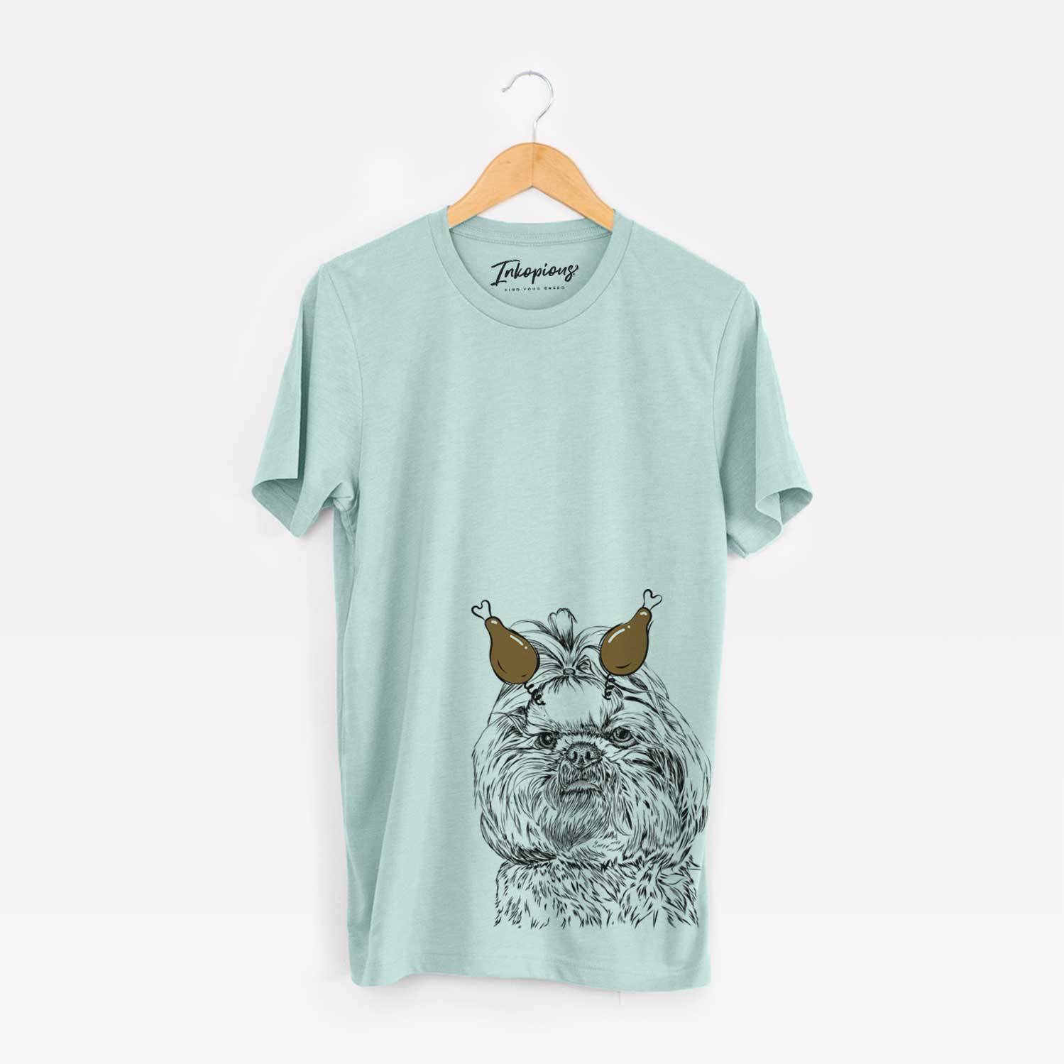 Hand-drawn sketch of Chewie the Shih Tzu with a Thanksgiving turkey headpiece on a Heather Sage Unisex crewneck