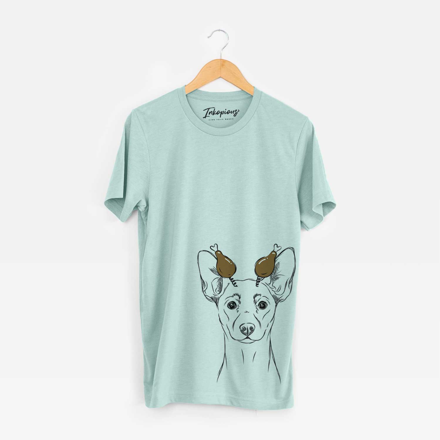 Hand-drawn sketch of Chillie the Mini Pinscher with a Thanksgiving turkey headpiece on a Heather Sage Unisex crewneck