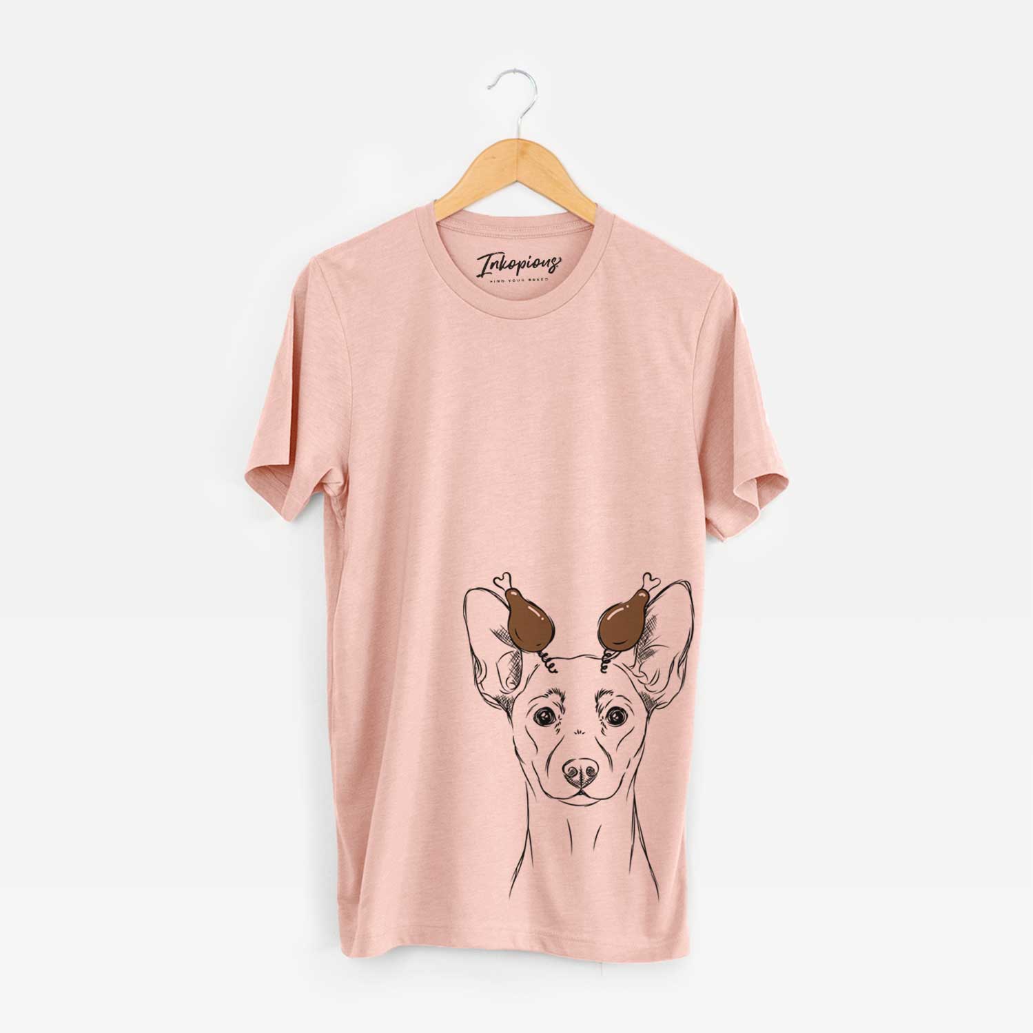 Hand-drawn sketch of Chillie the Mini Pinscher with a Thanksgiving turkey headpiece on a Peach Unisex crewneck