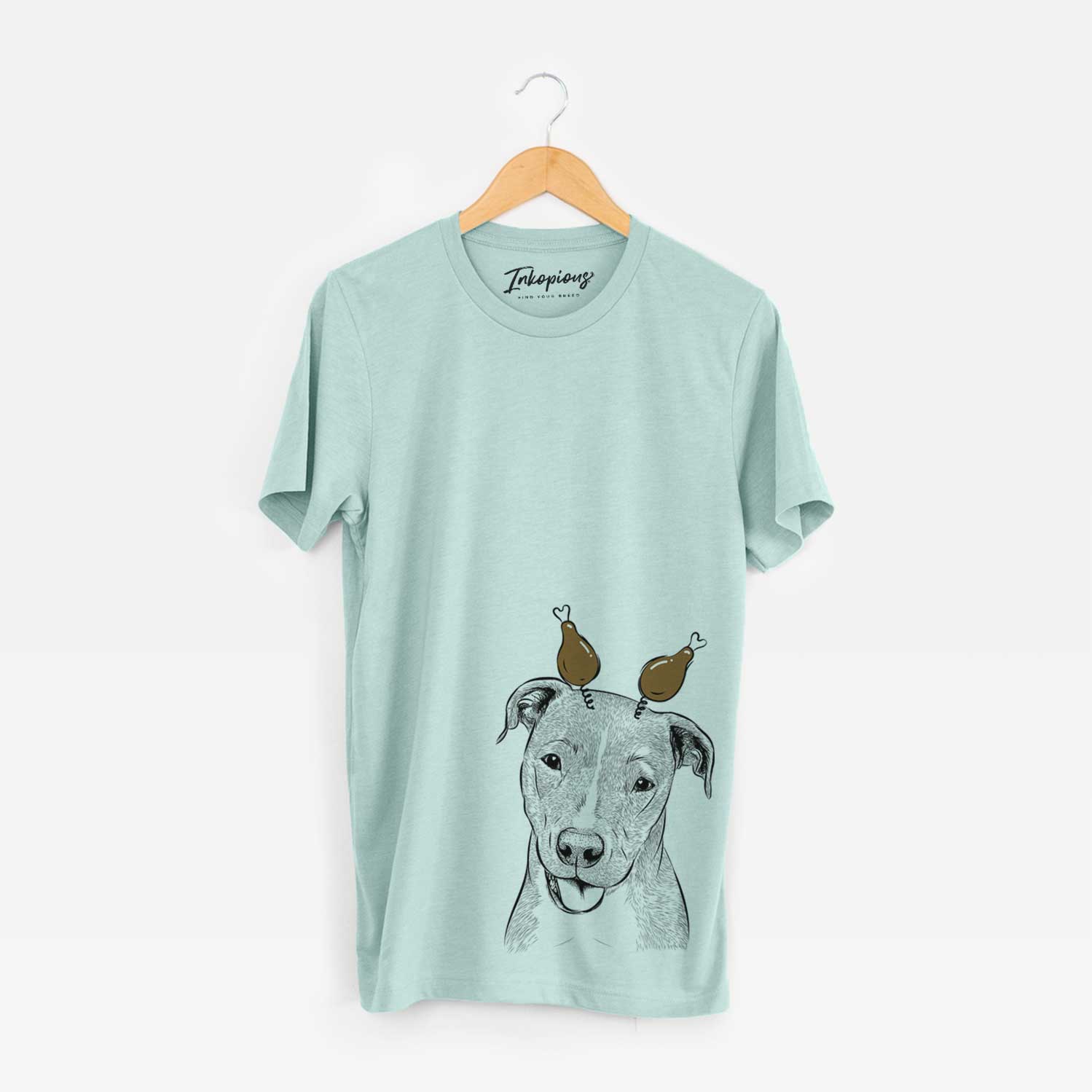 Hand-drawn sketch of Claiborne the American Staffordshire Terrier with a Thanksgiving turkey headpiece on a Heather Sage Unisex crewneck
