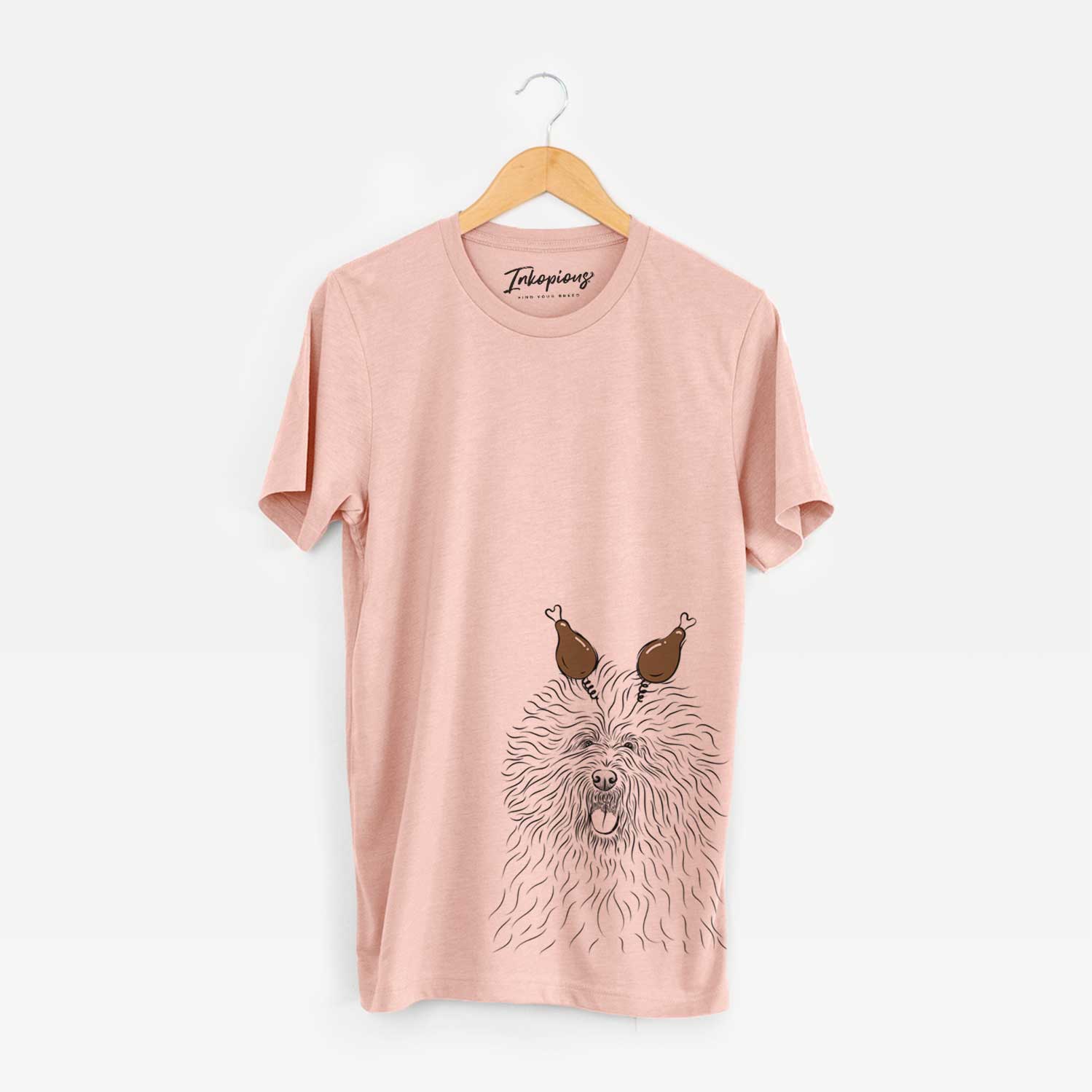 Hand-drawn sketch of Cozie the Old English Sheepdog with a Thanksgiving turkey headpiece on a Peach Unisex crewneck