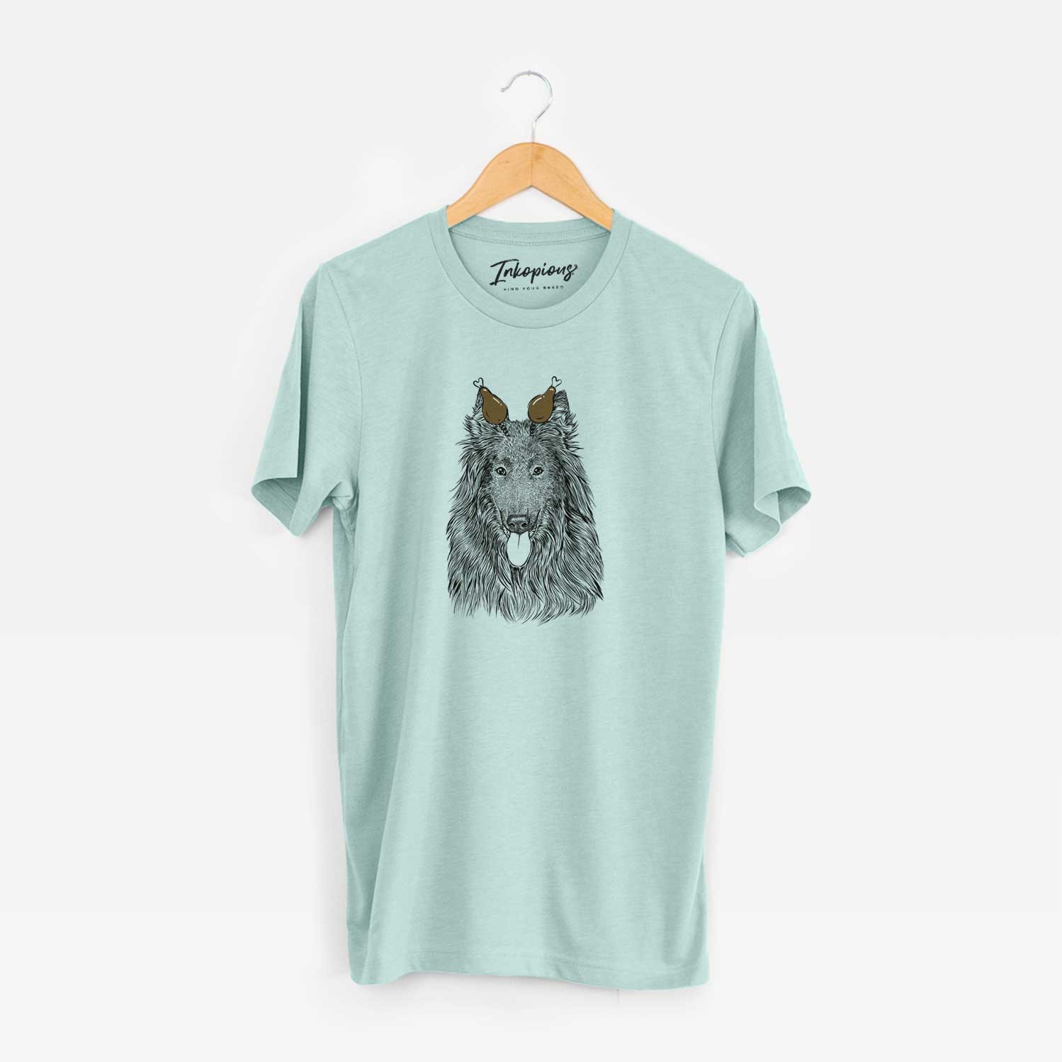 Hand-drawn sketch of Daan the Belgian Shepherd with a Thanksgiving turkey headpiece on a Heather Sage Unisex crewneck