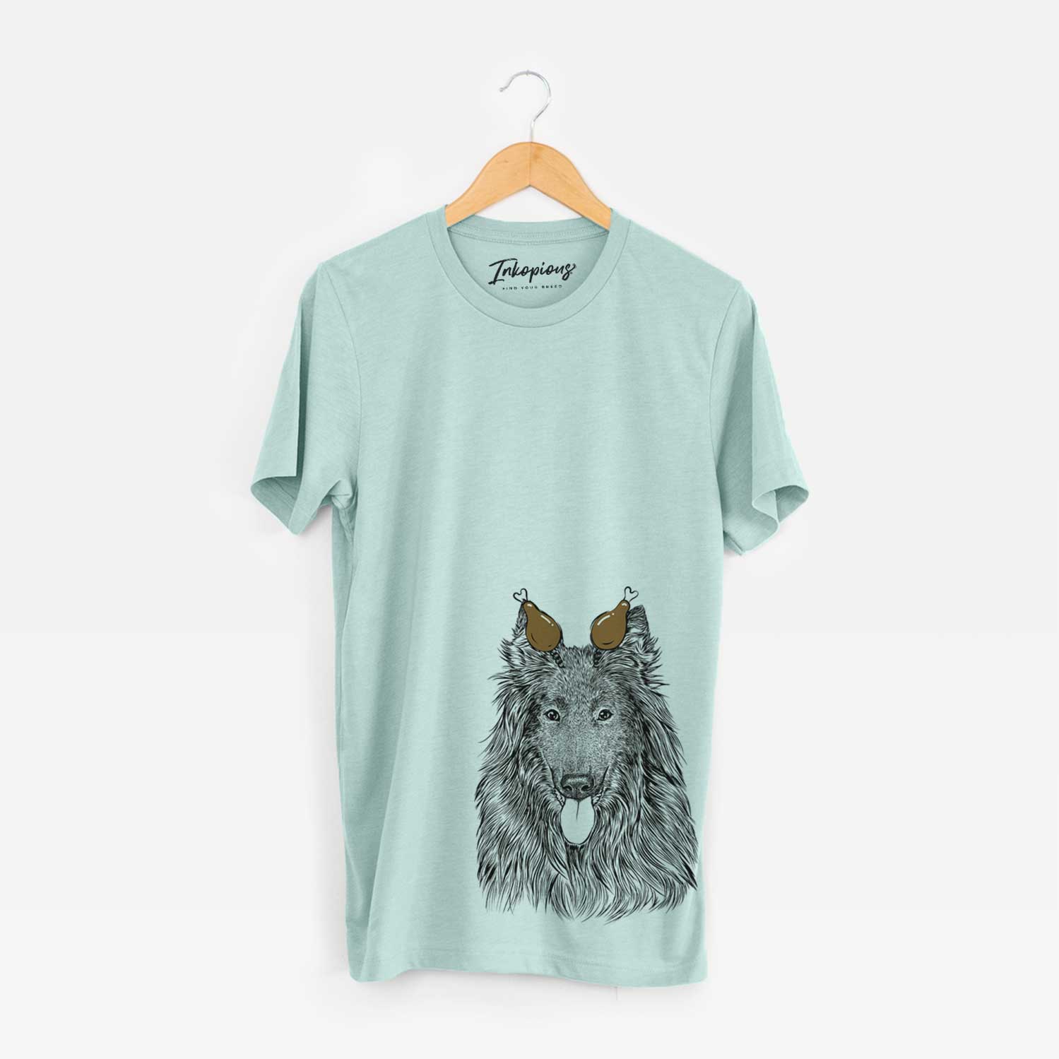 Hand-drawn sketch of Daan the Belgian Shepherd with a Thanksgiving turkey headpiece on a Heather Sage Unisex crewneck