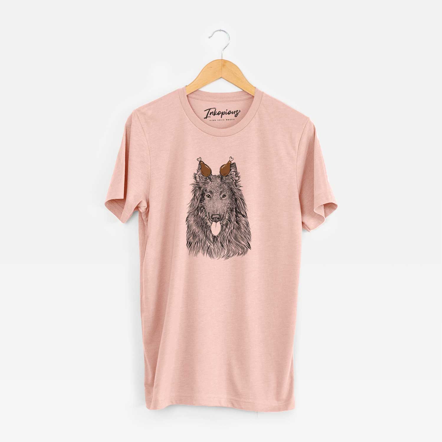 Hand-drawn sketch of Daan the Belgian Shepherd with a Thanksgiving turkey headpiece on a Peach Unisex crewneck