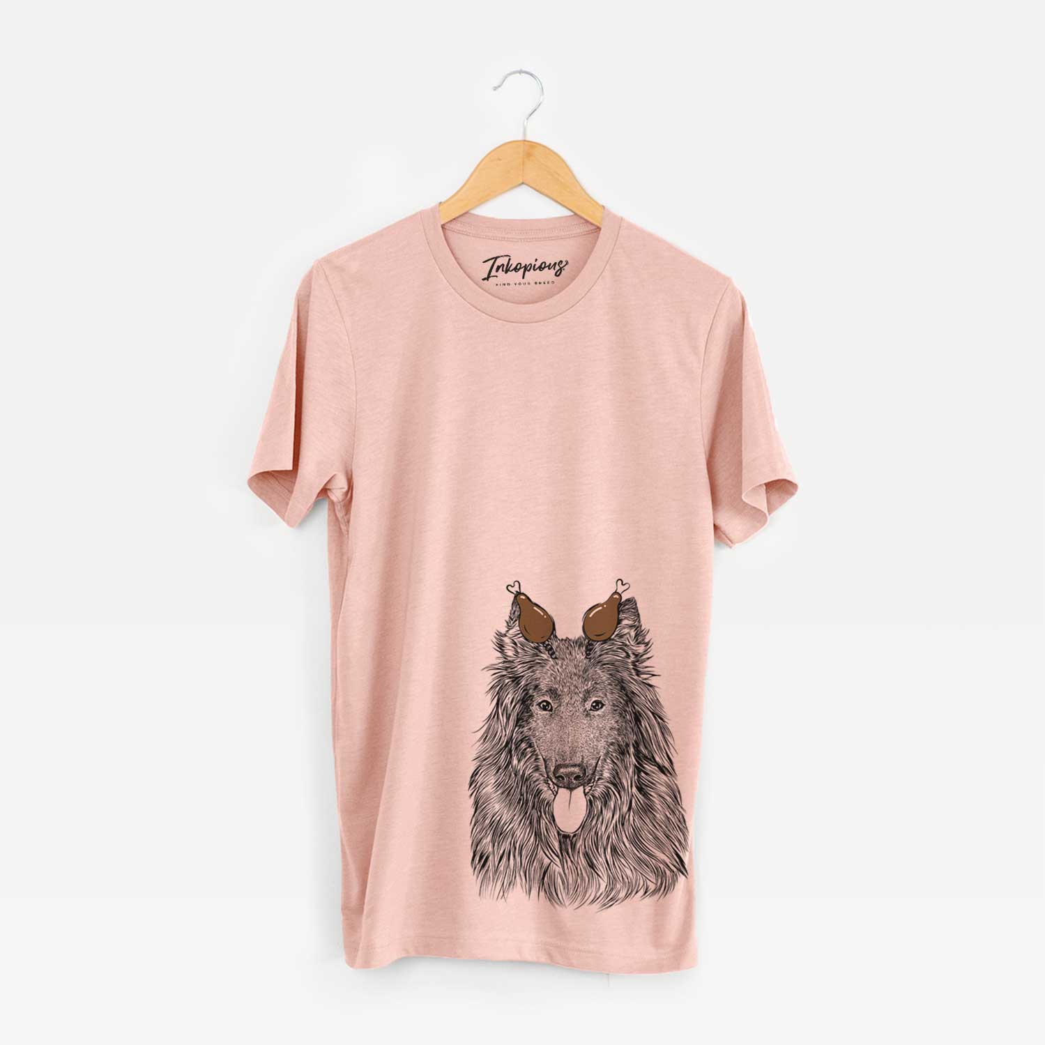 Hand-drawn sketch of Daan the Belgian Shepherd with a Thanksgiving turkey headpiece on a Peach Unisex crewneck