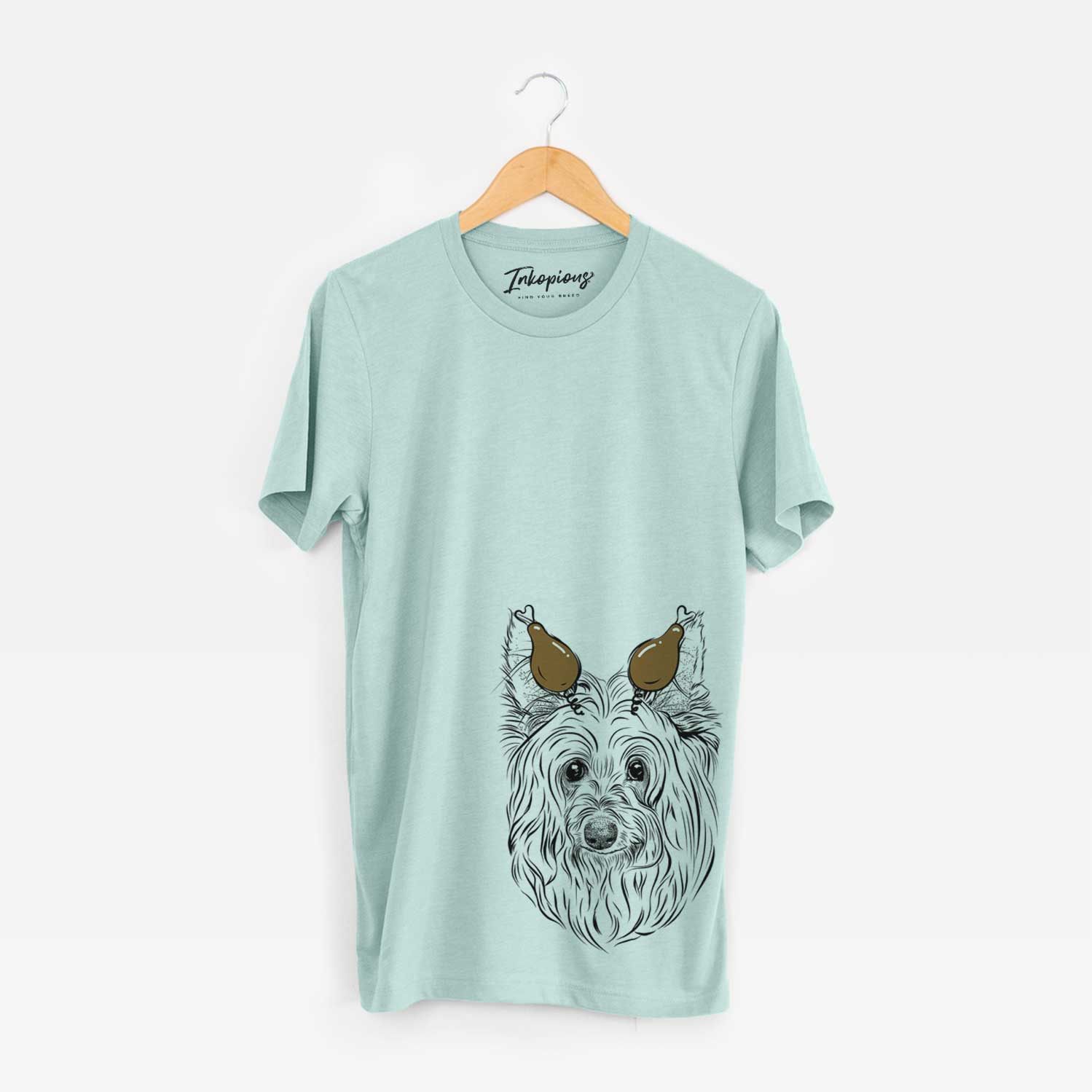Hand-drawn sketch of Daisy May the Silky Terrier with a Thanksgiving turkey headpiece on a Heather Sage Unisex crewneck