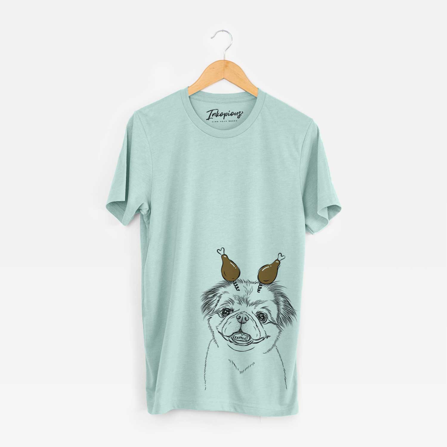Hand-drawn sketch of Danny the Pekingese with a Thanksgiving turkey headpiece on a Heather Sage Unisex crewneck