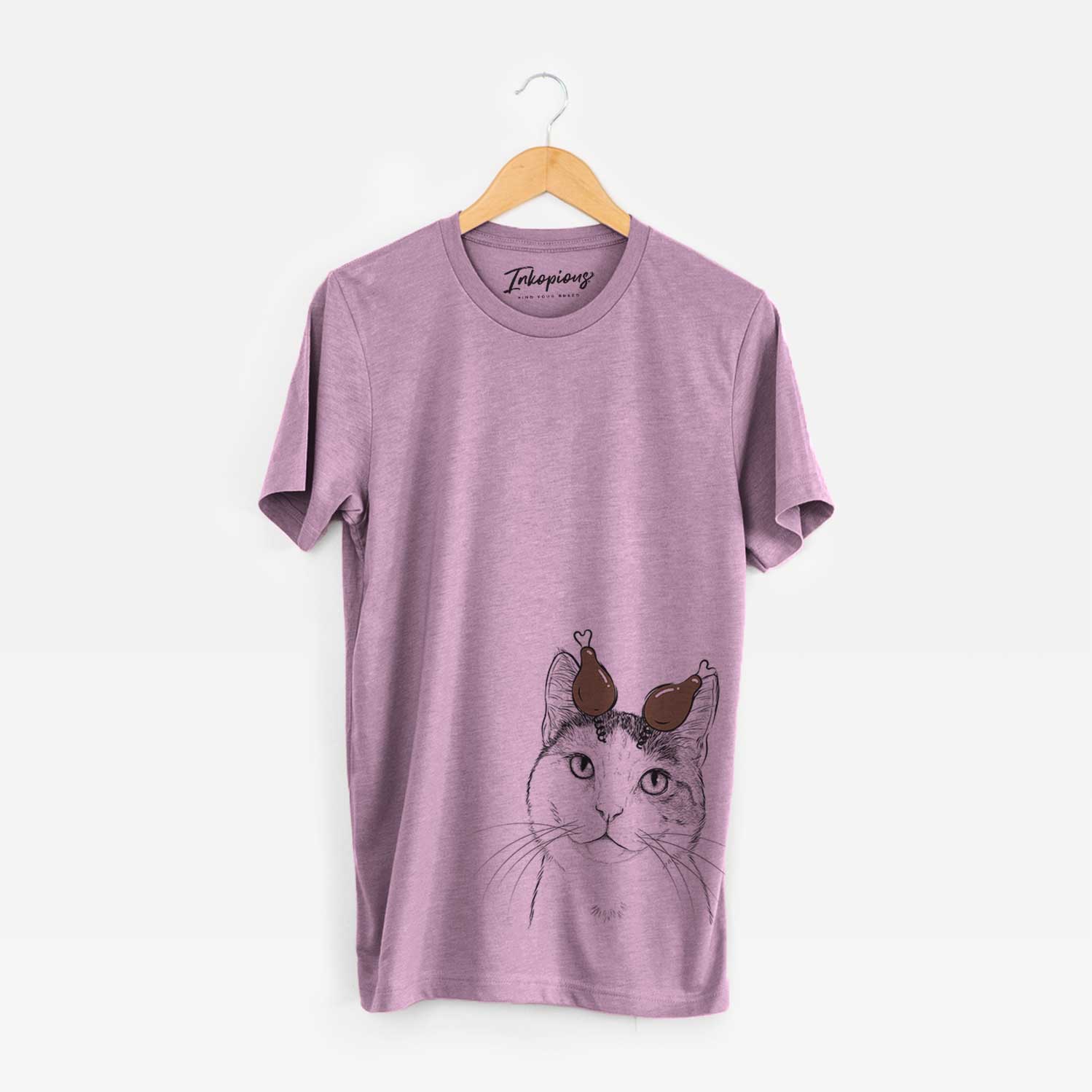 Hand-drawn sketch of Denver the Calico Cat with a Thanksgiving turkey headpiece on an Orchid Unisex crewneck
