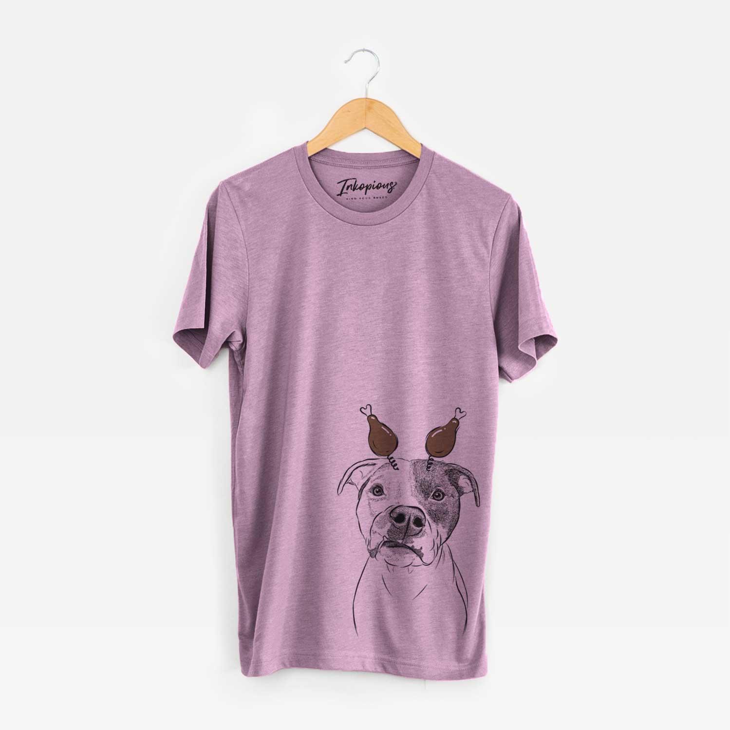 Hand-drawn sketch of Dexter the Pitbull with a Thanksgiving turkey headpiece on an Orchid Unisex crewneck