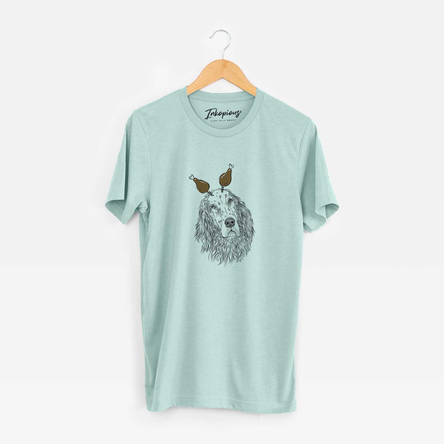 Hand-drawn sketch of Dexter the English Setter with a Thanksgiving turkey headpiece on a Heather Sage Unisex crewneck
