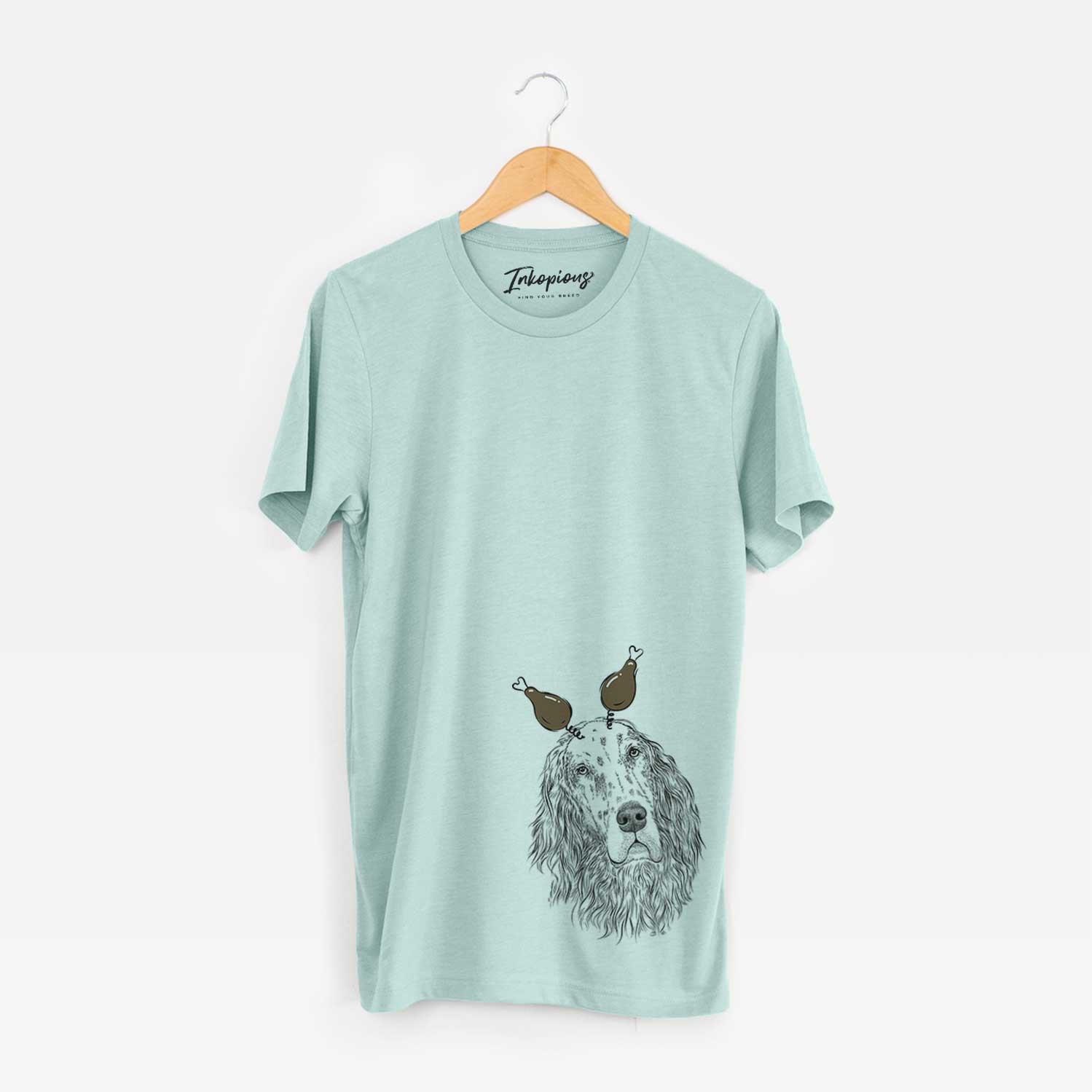 Hand-drawn sketch of Dexter the English Setter with a Thanksgiving turkey headpiece on a Heather Sage Unisex crewneck
