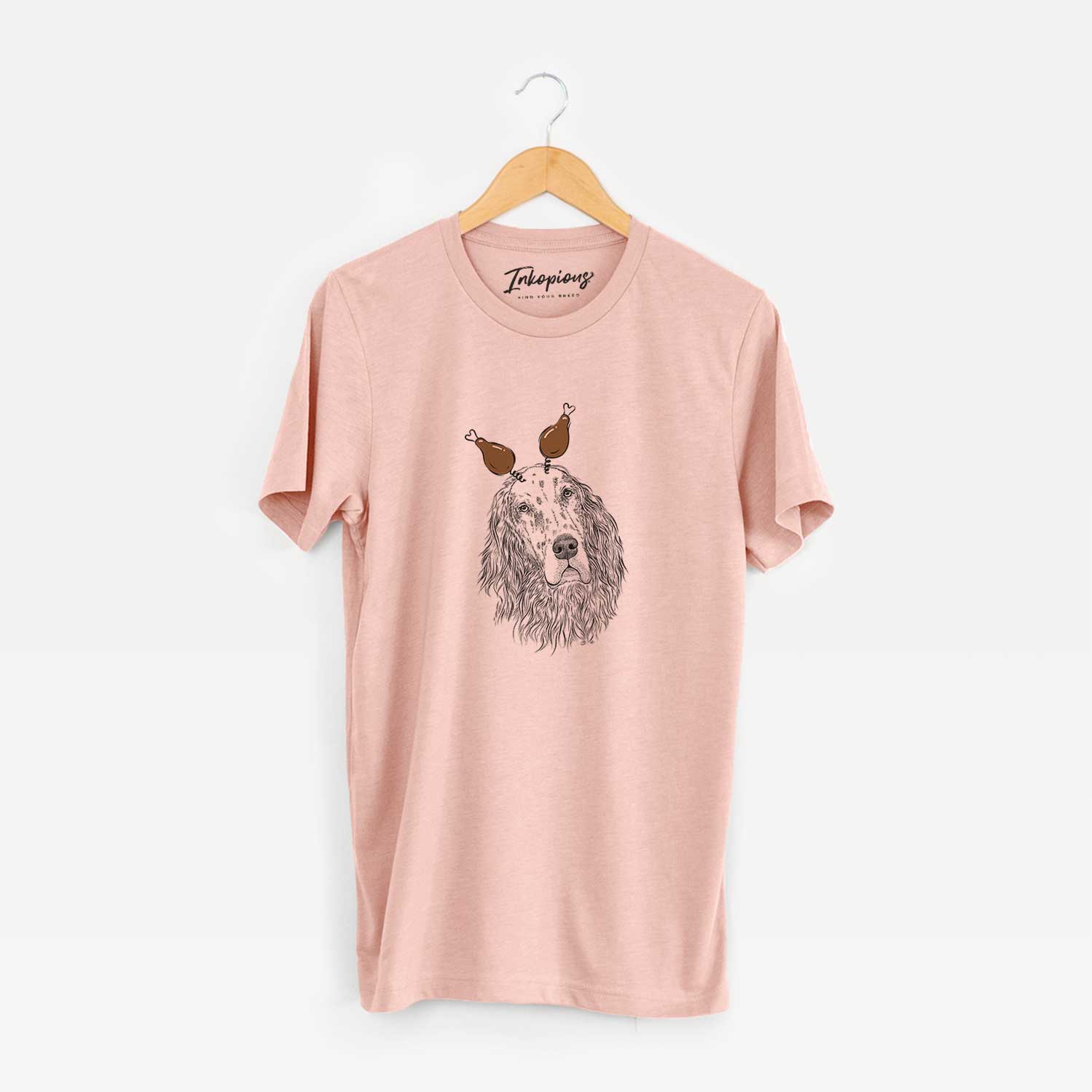 Hand-drawn sketch of Dexter the English Setter with a Thanksgiving turkey headpiece on a Peach Unisex crewneck