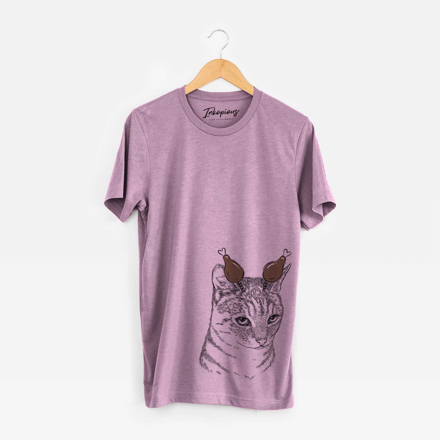 Hand-drawn sketch of Dora the Tabby Cat with a Thanksgiving turkey headpiece on an Orchid Unisex crewneck