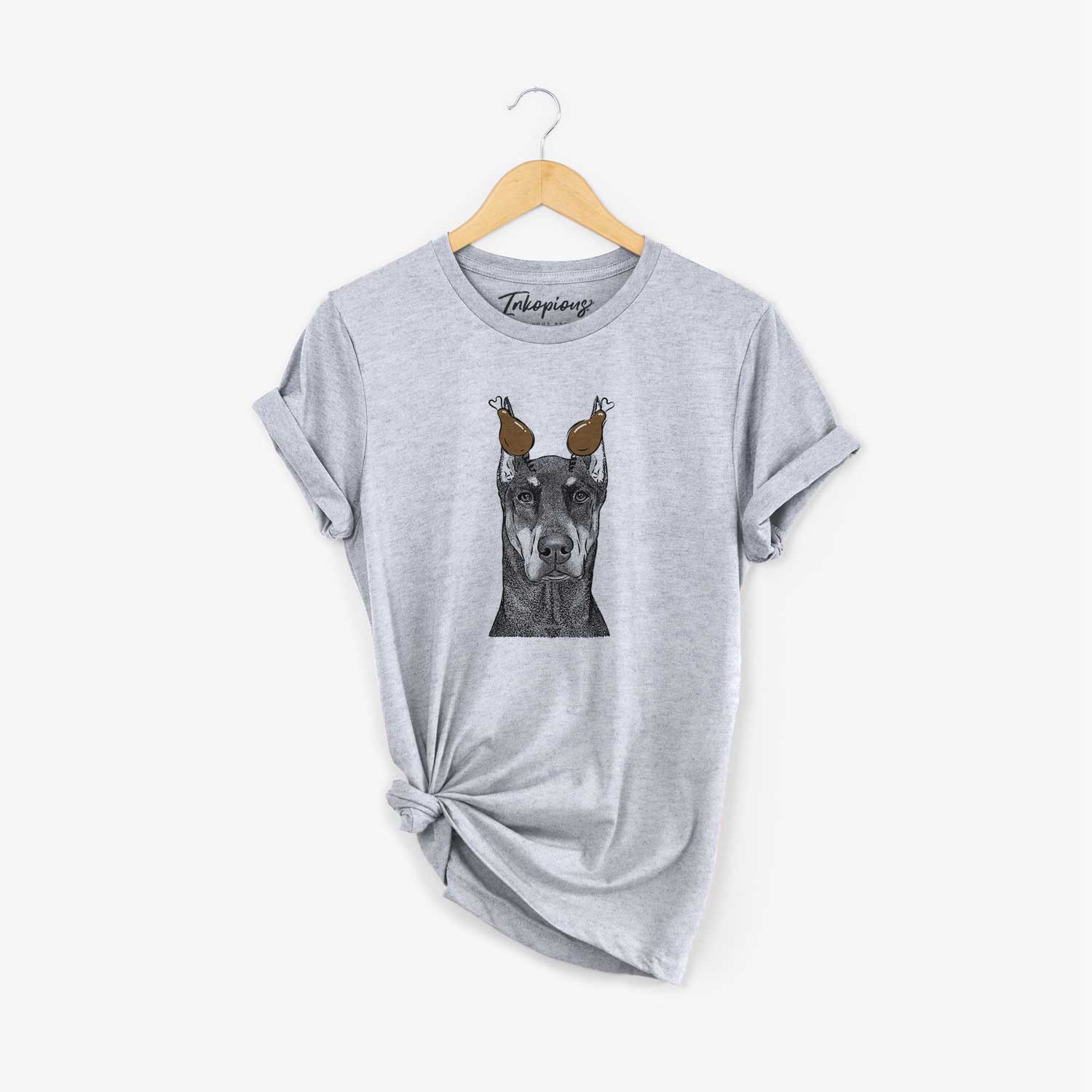 Hand-drawn sketch of Drake the Doberman Pinscher with a Thanksgiving turkey headpiece on a Grey Unisex crewneck