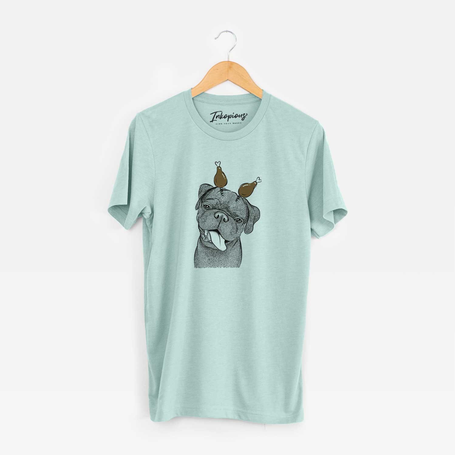 Hand-drawn sketch of Dudley Danger the Pug with a Thanksgiving turkey headpiece on a Heather Sage Unisex crewneck