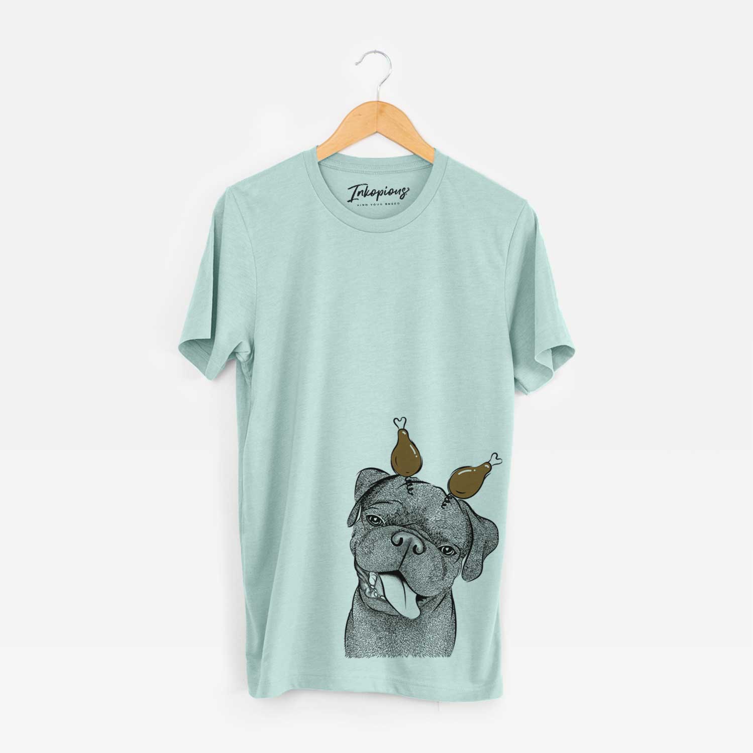 Hand-drawn sketch of Dudley Danger the Pug with a Thanksgiving turkey headpiece on a Heather Sage Unisex crewneck