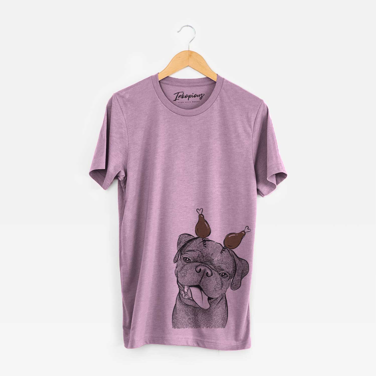 Hand-drawn sketch of Dudley Danger the Pug with a Thanksgiving turkey headpiece on an Orchid Unisex crewneck