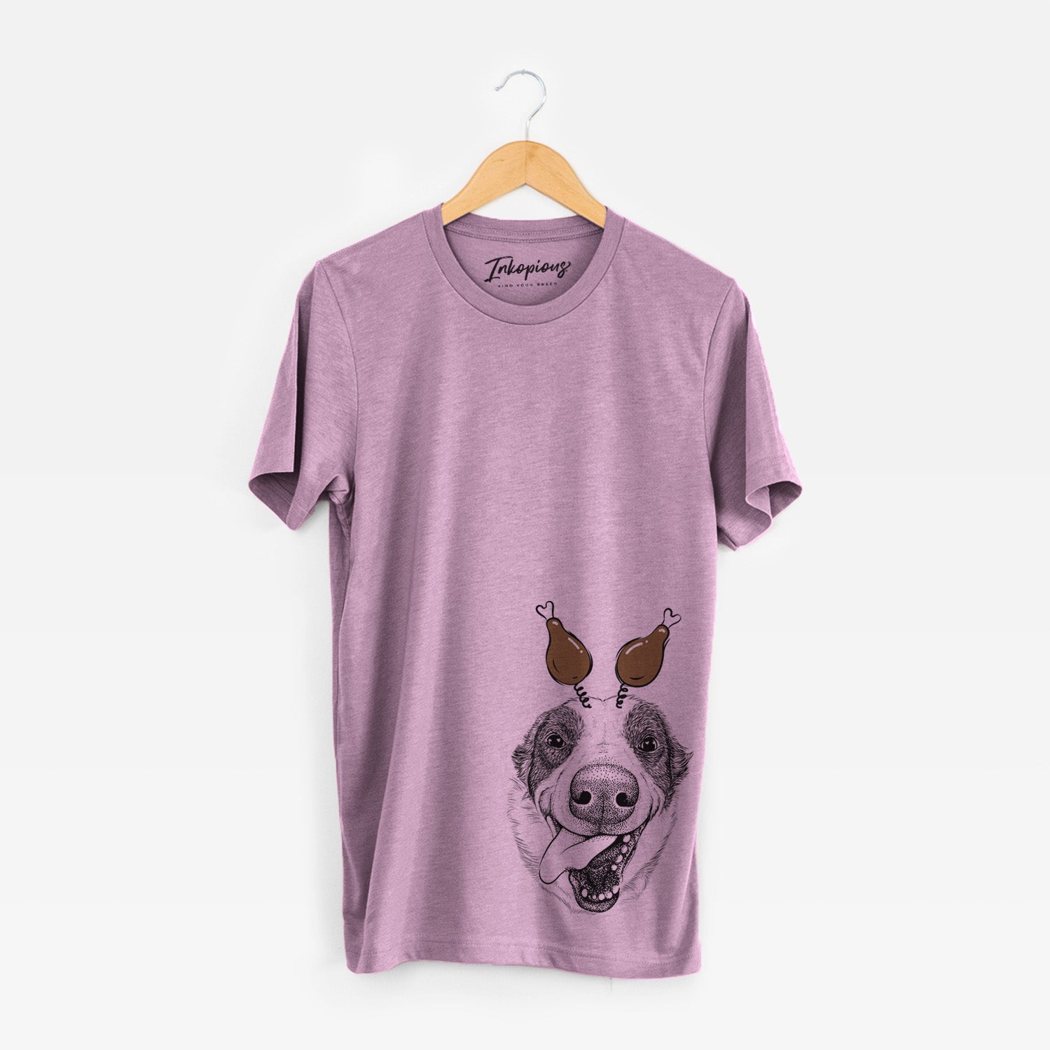 Hand-drawn sketch of Elwood the Border Collie with a Thanksgiving turkey headpiece on an Orchid Unisex crewneck