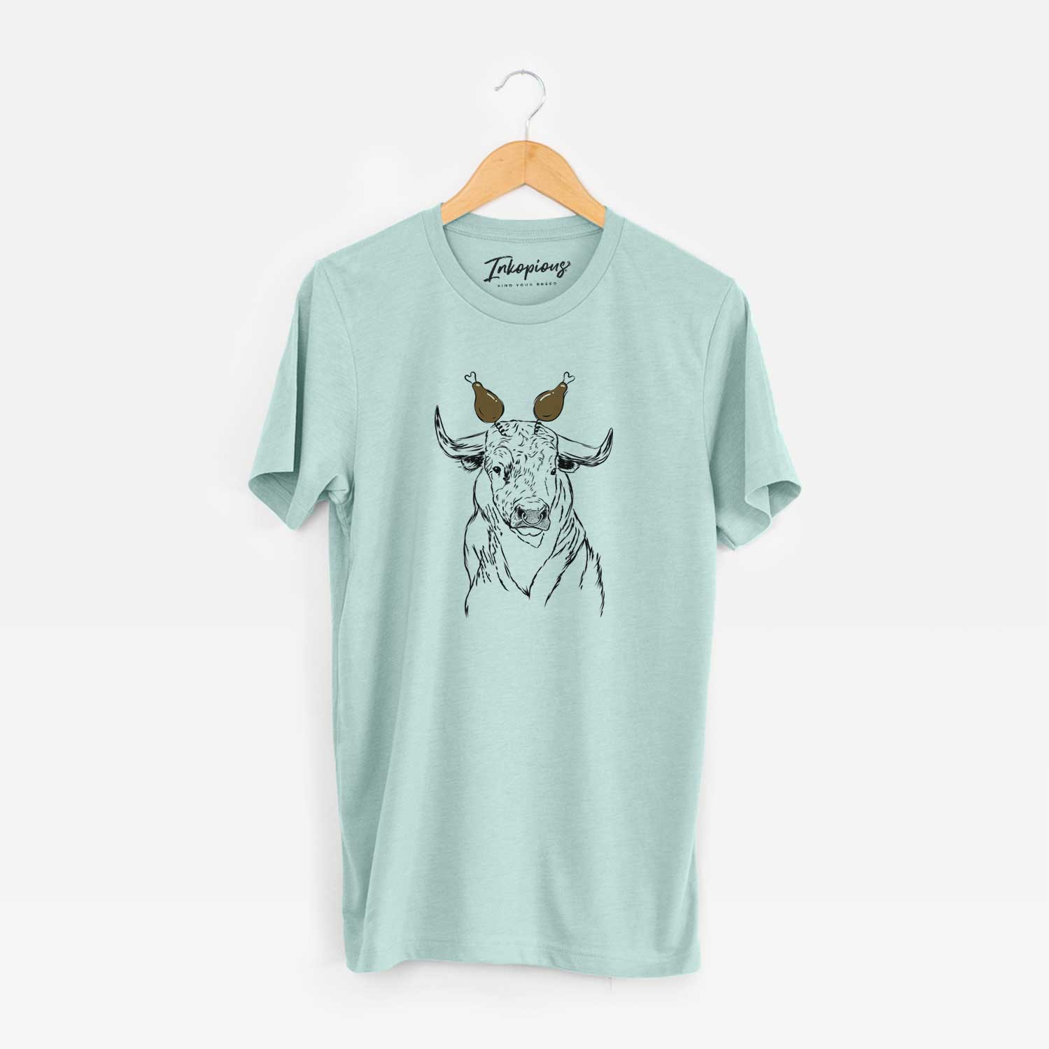 Hand-drawn sketch of Ferdinand the Bull with a Thanksgiving turkey headpiece on a Heather Sage Unisex crewneck
